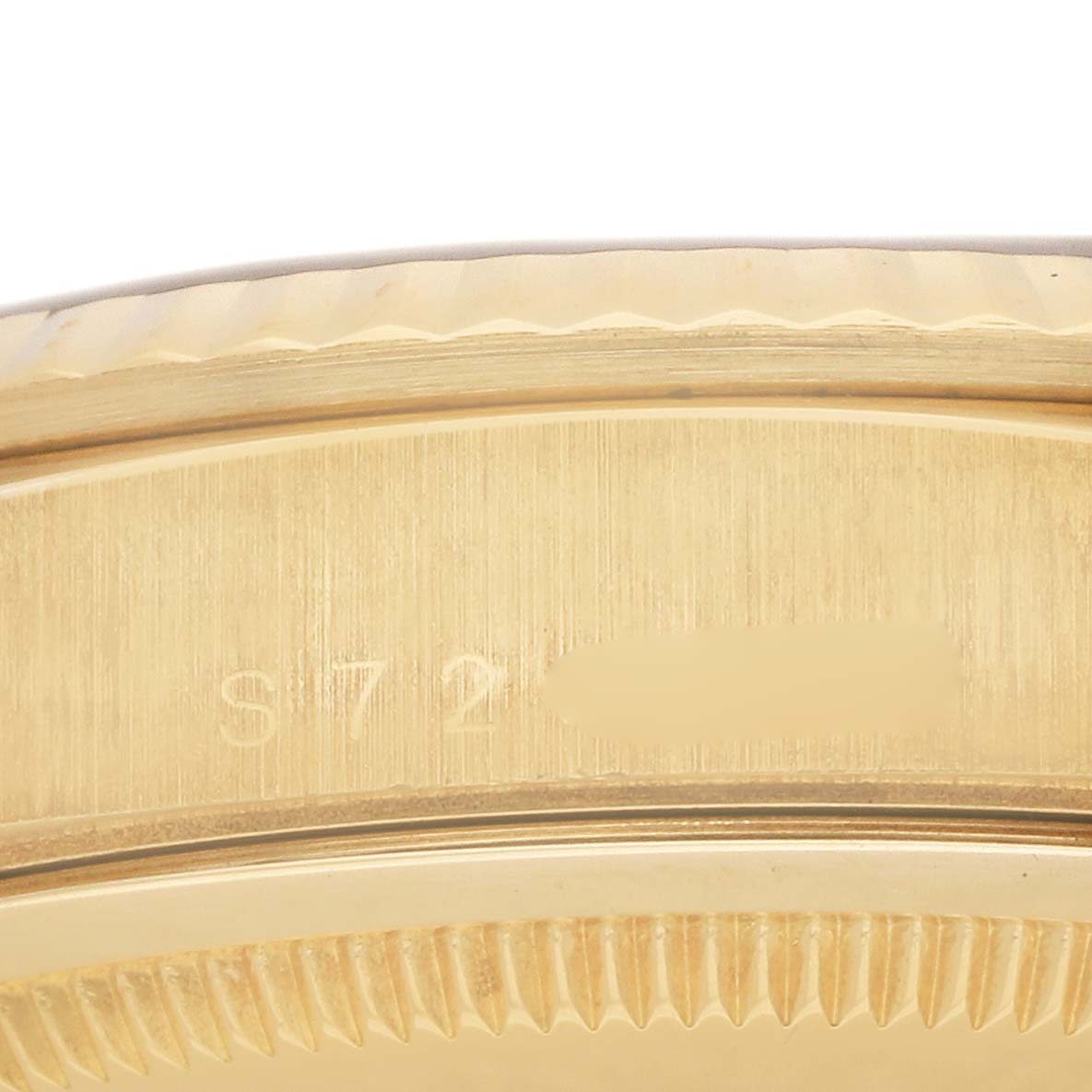 The image is a close-up view of the case back edge and serial number of a Rolex President 18238 Men's Yellow Gold Champagne Dial 18238 Men's Yellow Gold Champagne Dial model watch.