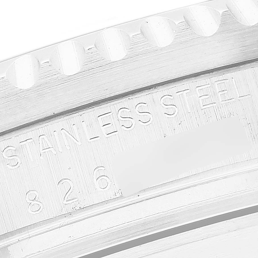 The image shows a close-up angle of the engraved stainless steel case back of the Vintage Collection Rolex watch.
