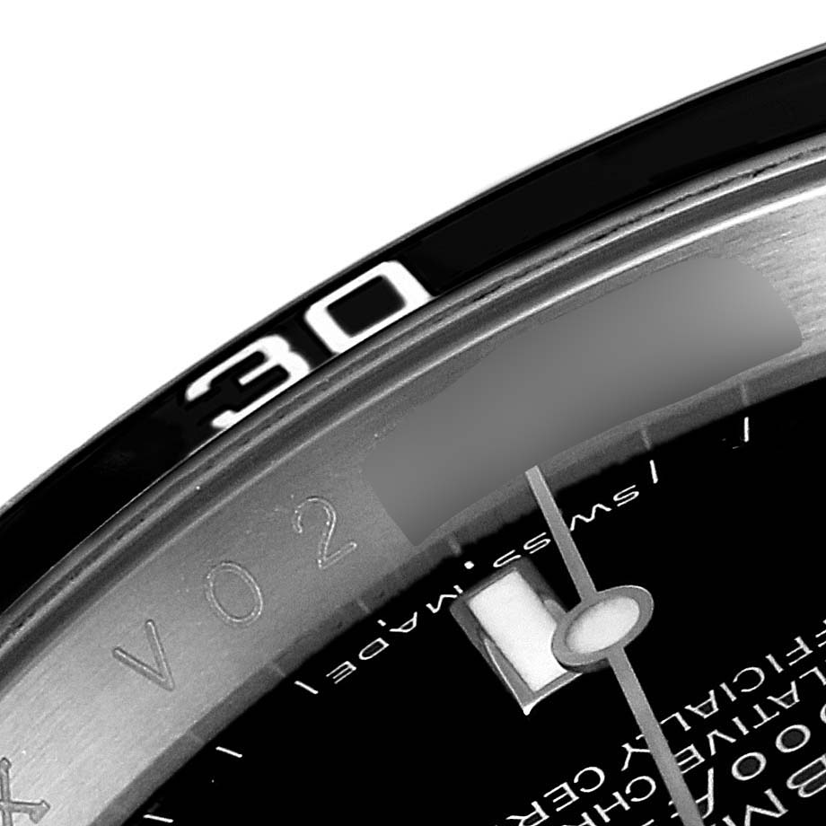 This close-up view of the Rolex Submariner 16610 Men
s Stainless Steel Black Dial 16610 Men
s Stainless Steel Black Dial watch shows the bezel
s "30" marker and part of the dial with the seconds hand.