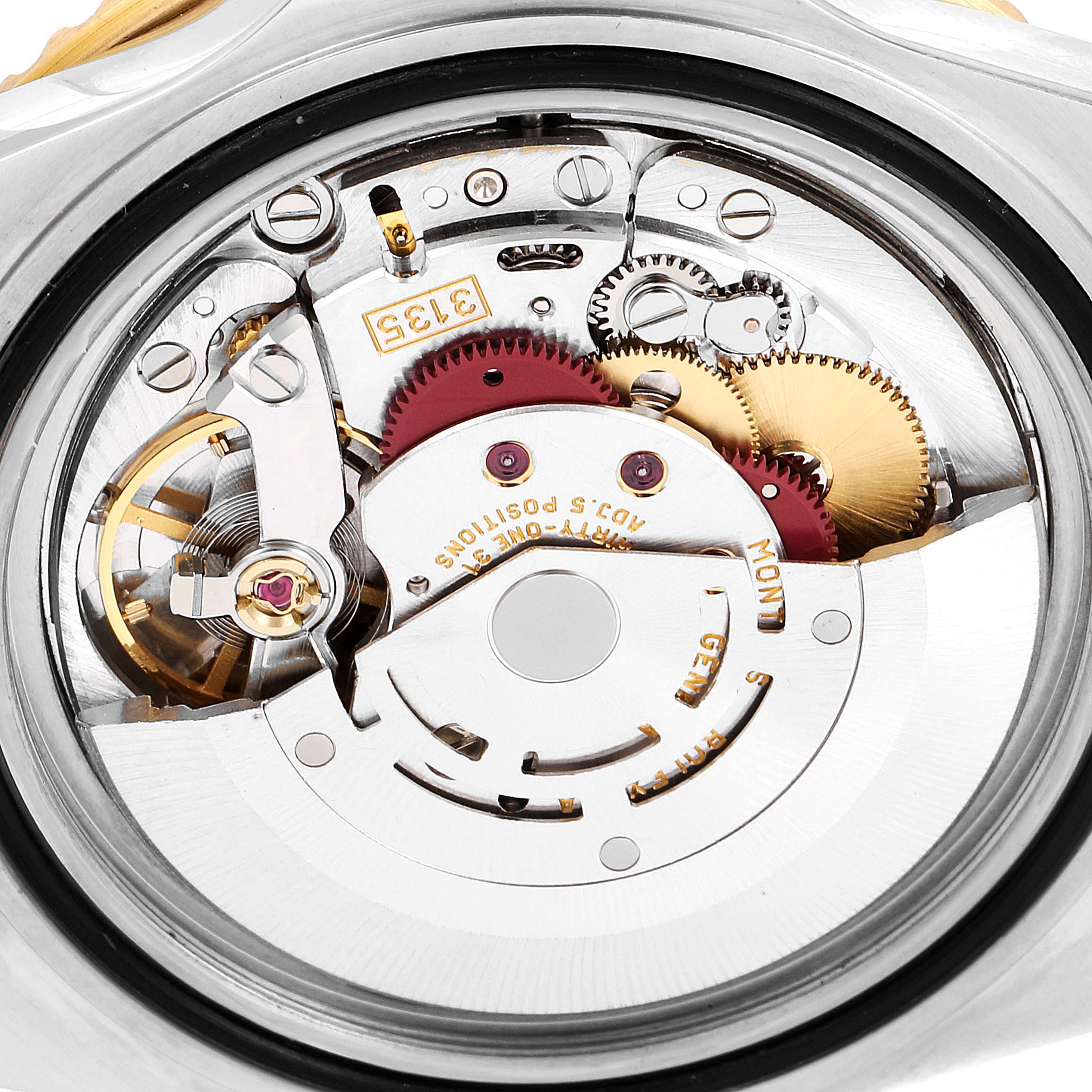 This image shows a close-up view of the movement mechanism of a Rolex Submariner 16613 Men's Steel and Gold (two tone) Black Dial 16613 Men's Steel and Gold (two tone) Black Dial watch.