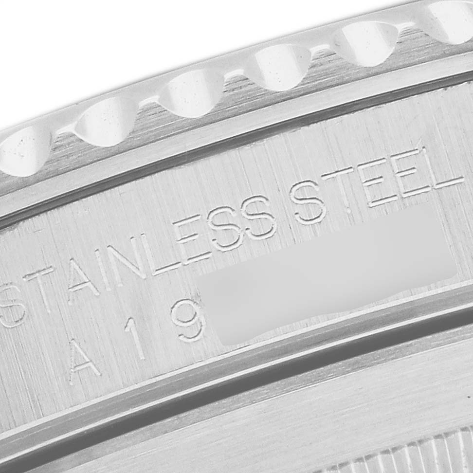 This image shows a close-up of the engraved stainless steel case back of a Rolex Submariner 14060 Men's Stainless Steel Black Dial 14060 Men's Stainless Steel Black Dial watch.