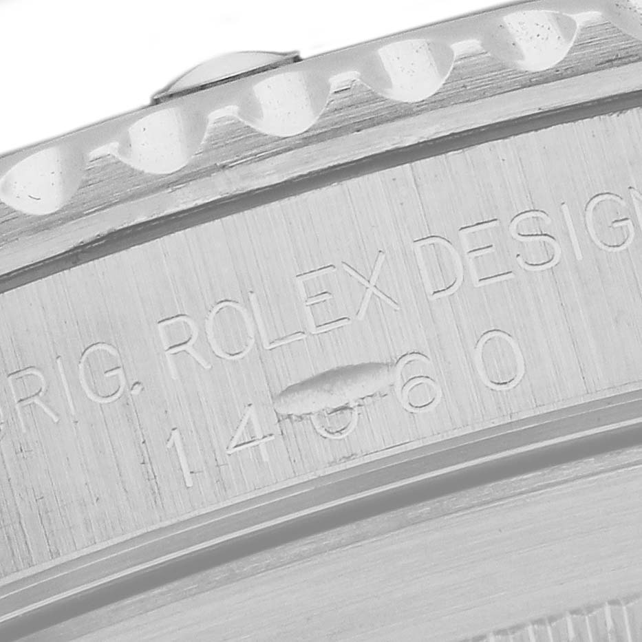 The image shows a close-up of the side engraving and bezel of a Rolex Submariner 14060 Men's Stainless Steel Black Dial 14060 Men's Stainless Steel Black Dial watch.