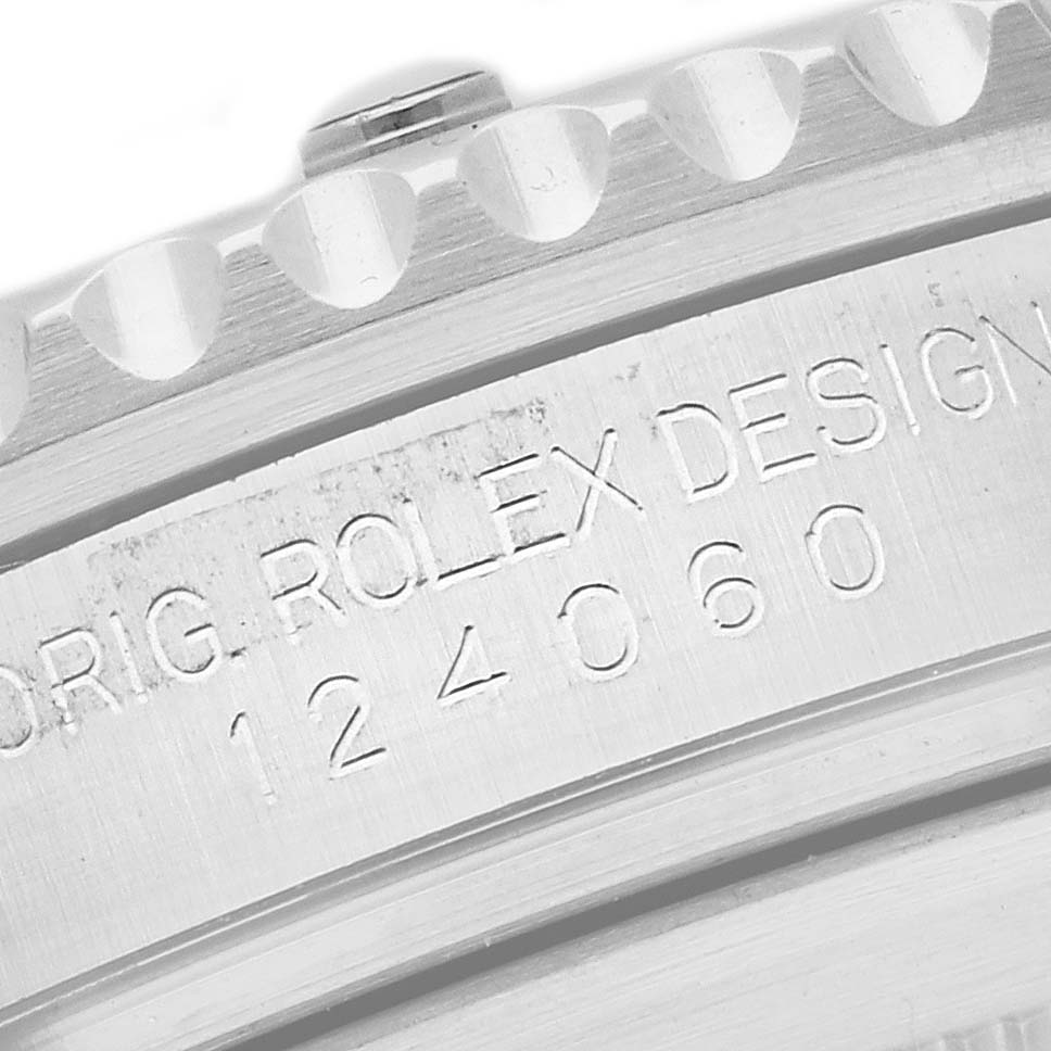 The image shows an up-close view of the engraved serial number on the case side of a Rolex Submariner 124060 Men's Stainless Steel Black Dial 124060 Men's Stainless Steel Black Dial watch.