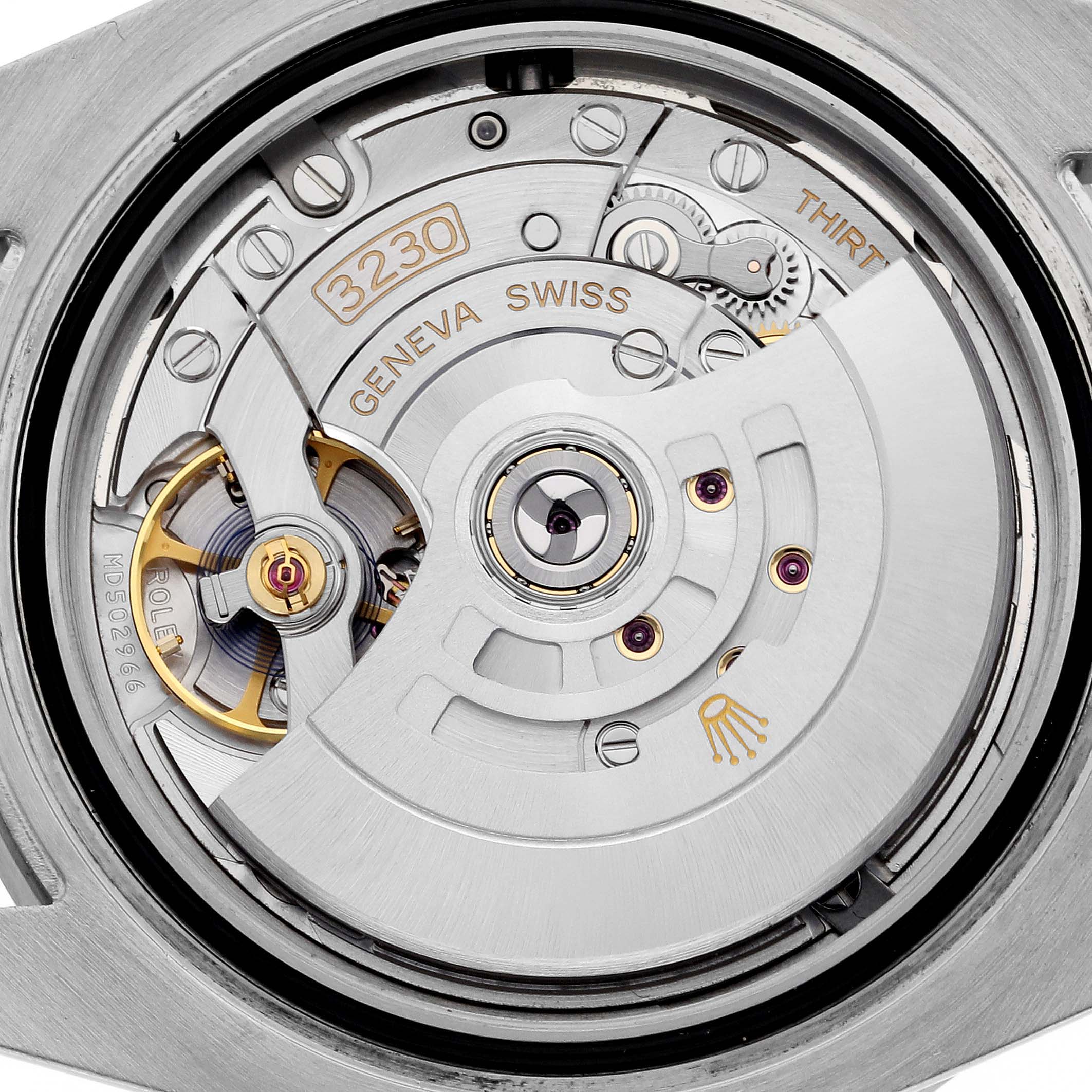 This is a close-up view of the Rolex Submariner 124060 Men's Stainless Steel Black Dial 124060 Men's Stainless Steel Black Dial's movement, highlighting the caliber 3230 mechanism.