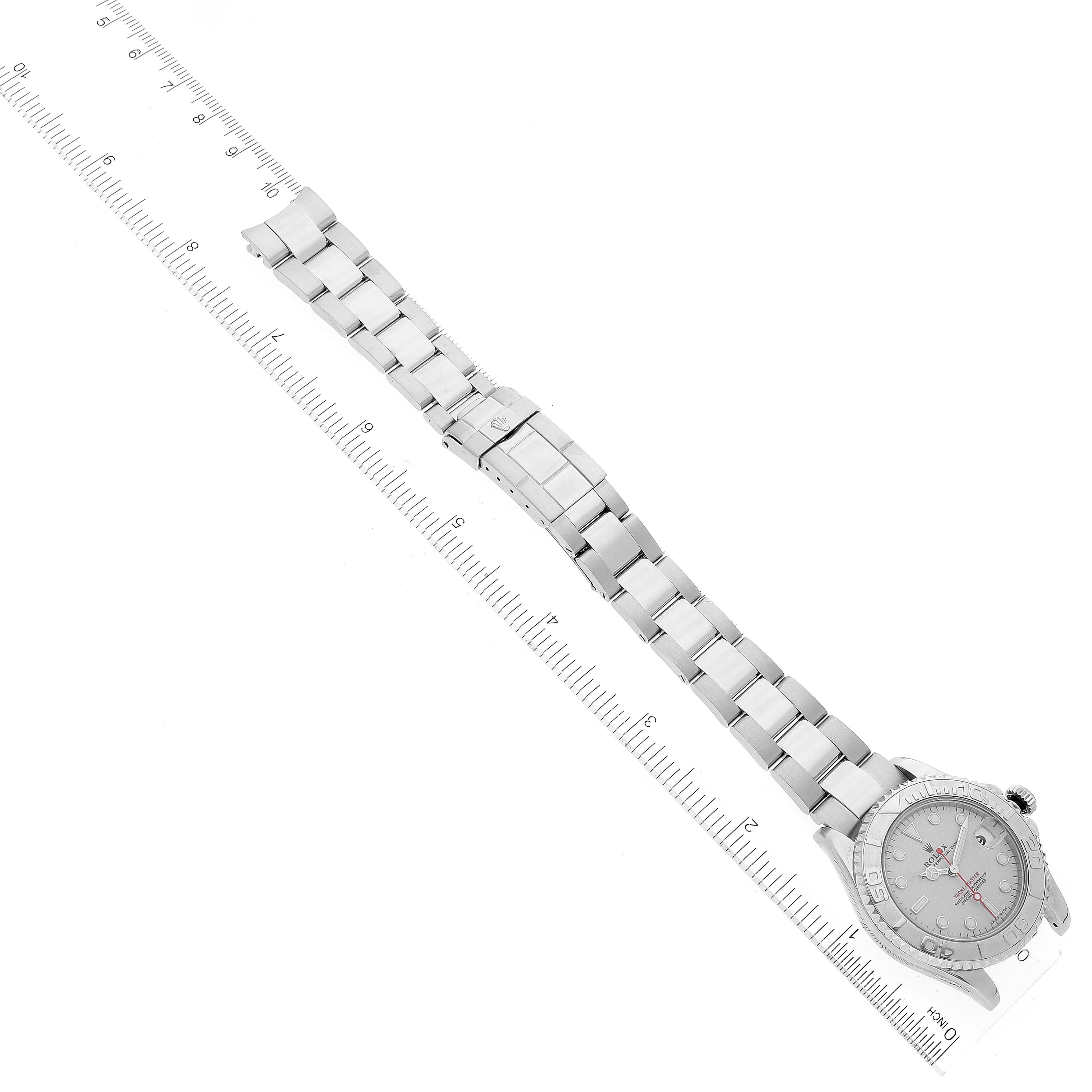 The Rolex Yacht-Master 168622 Men's Stainless Steel Silver Dial 168622 Men's Stainless Steel Silver Dial watch is shown at a top-down angle, displaying the entire bracelet and face next to a ruler for size reference.