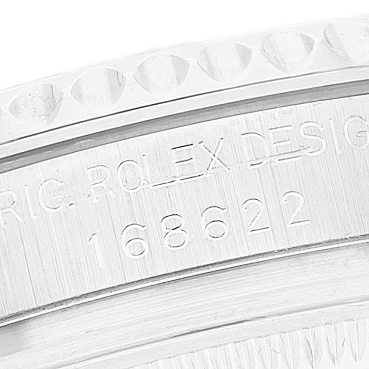 The image shows a close-up of the Yacht-Master model by Rolex, highlighting the engraved serial number and part of the bezel.