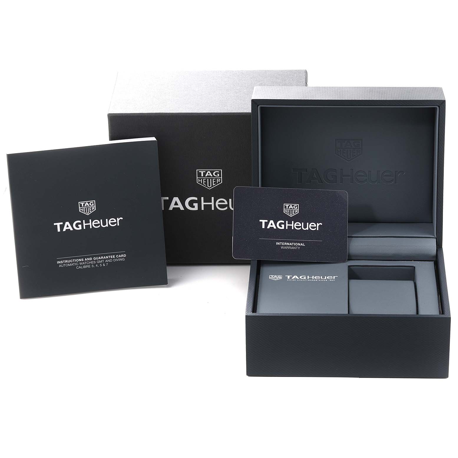 The image shows the packaging and accessories for a Tag Heuer Aquaracer WBP2010.BA0632 Men's Stainless Steel Blue Dial WBP2010.BA0632 Men's Stainless Steel Blue Dial watch, including the box, instructions, and warranty card.