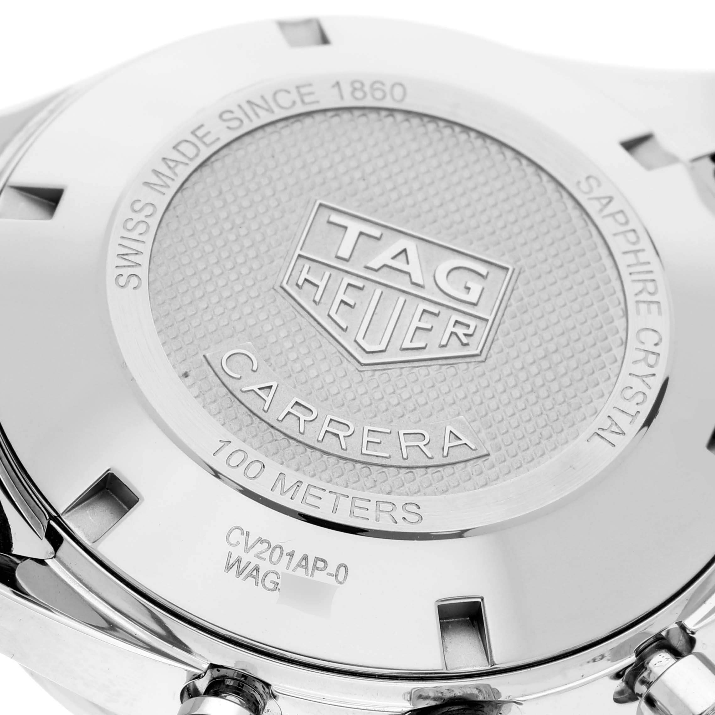 The image shows the back case and inscriptions of a Tag Heuer Carrera CV201AP.FC6429 Men's Stainless Steel Black Dial CV201AP.FC6429 Men's Stainless Steel Black Dial watch, featuring the logo and water resistance details.