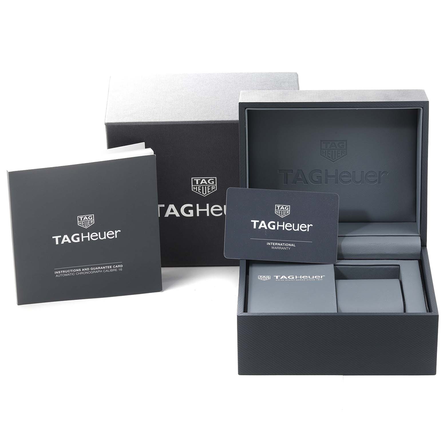 The image shows the packaging, warranty card, and instruction manual for a Tag Heuer Carrera CV201AP.FC6429 Men's Stainless Steel Black Dial CV201AP.FC6429 Men's Stainless Steel Black Dial model watch.