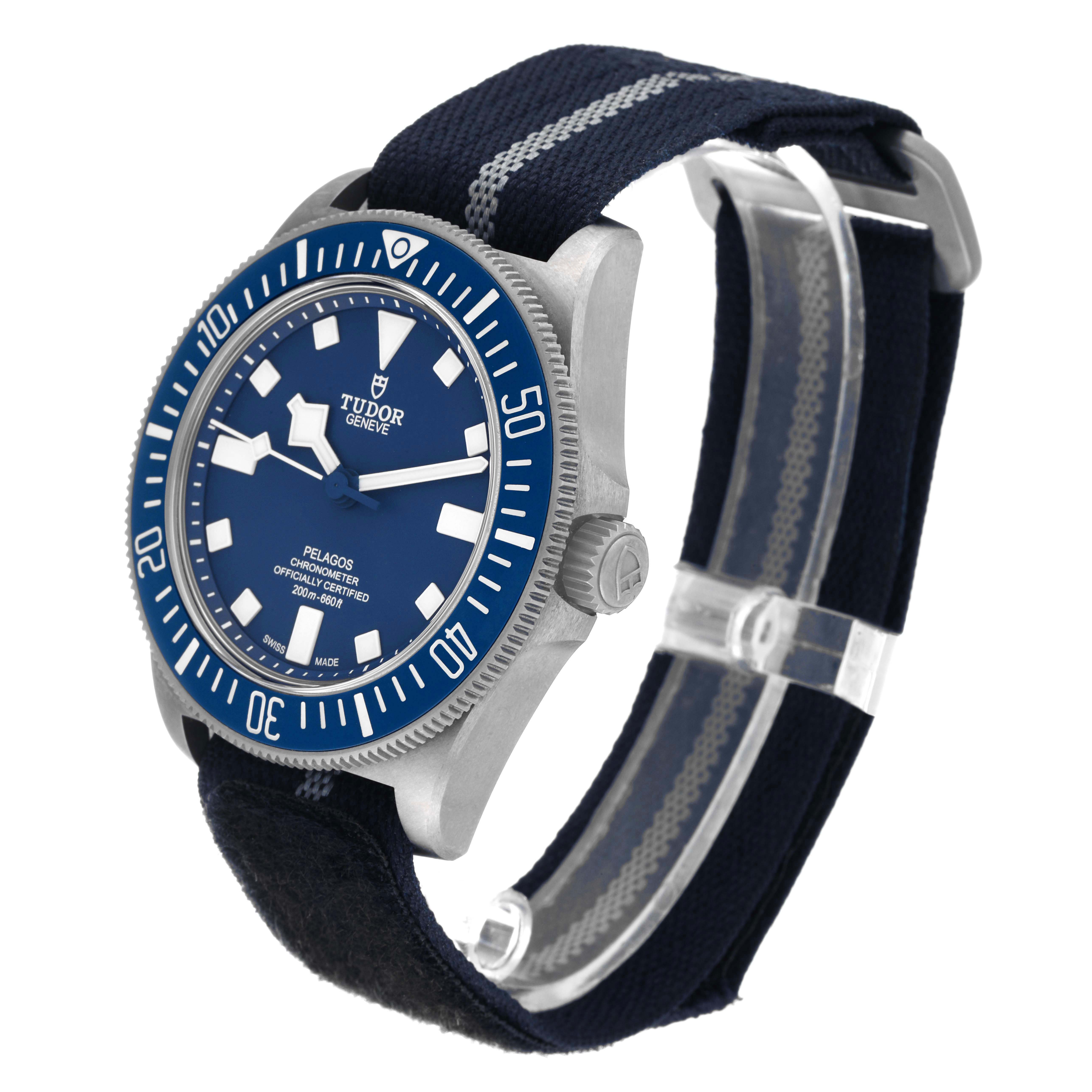 The Tudor Pelagos 25707 Men's Titanium Blue Dial 25707 Men's Titanium Blue Dial watch is shown at a slight angle, showcasing its face, crown, and fabric strap.