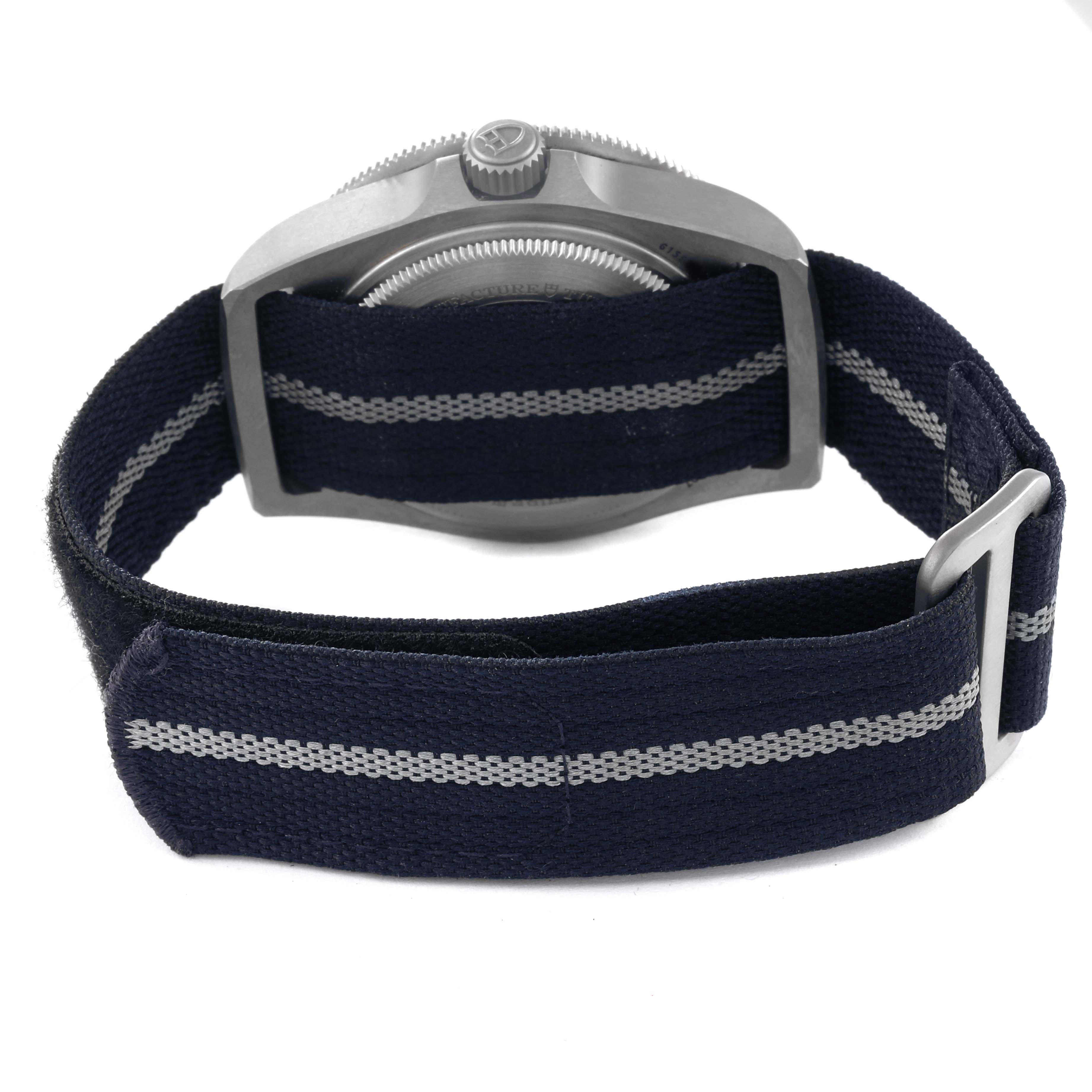 This Tudor Pelagos 25707 Men's Titanium Blue Dial 25707 Men's Titanium Blue Dial watch is shown from the side angle, highlighting the casing and fabric strap with its fastening mechanism.