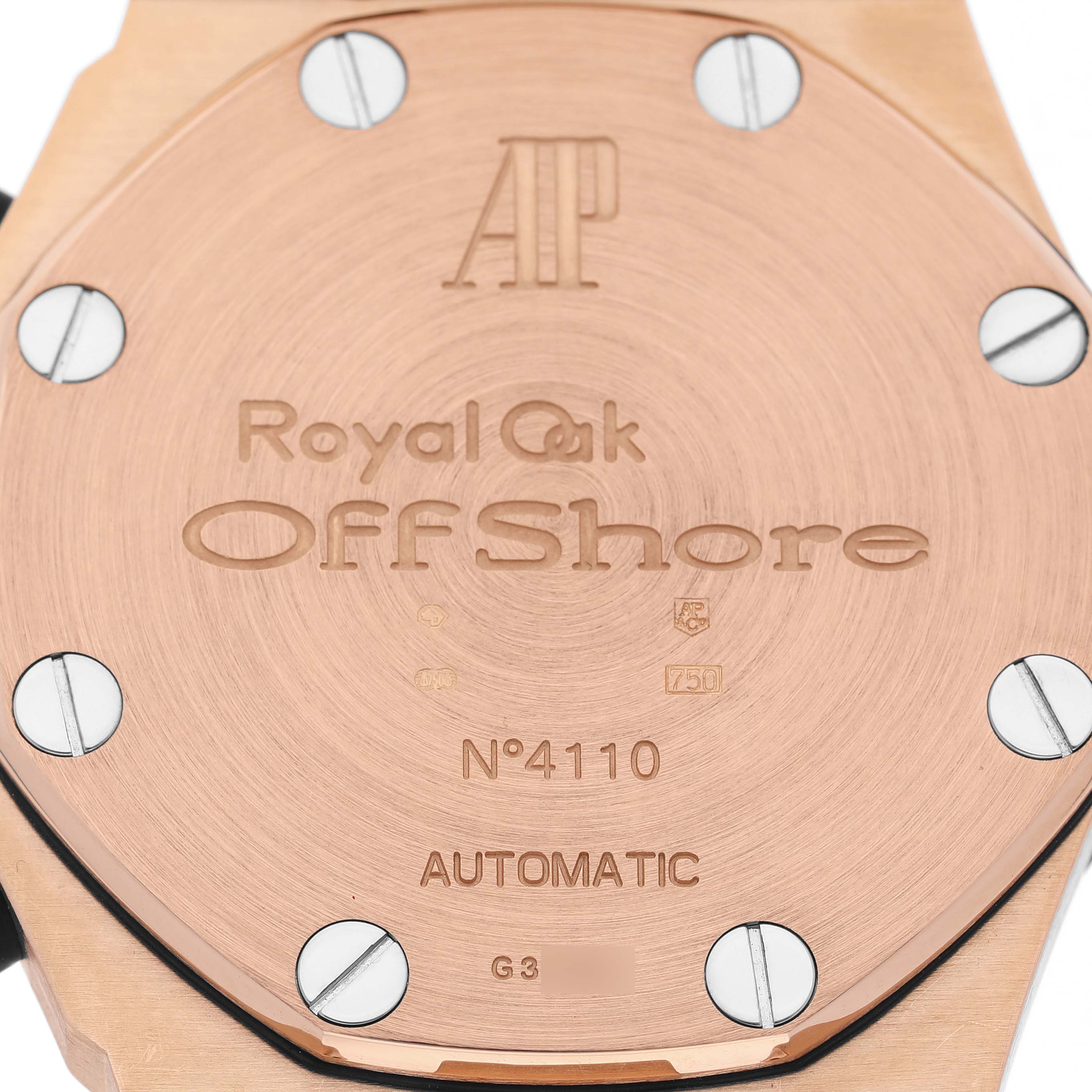 The image shows the case back of an Audemars Piguet Royal Oak Offshore 26170OR.OO.1000OR.01 Men's Rose Gold Silver Dial watch, featuring engraving details.