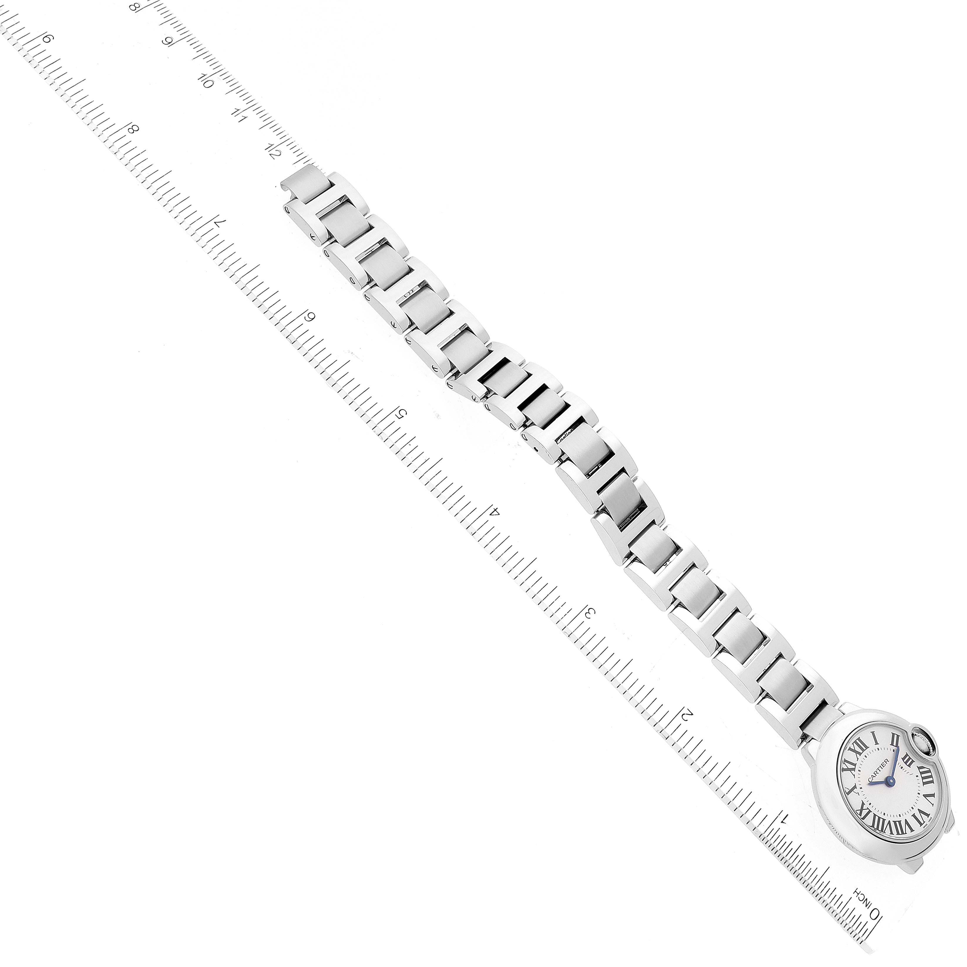 The image shows a Ballon Bleu de Cartier watch laid flat with a ruler to measure its length.