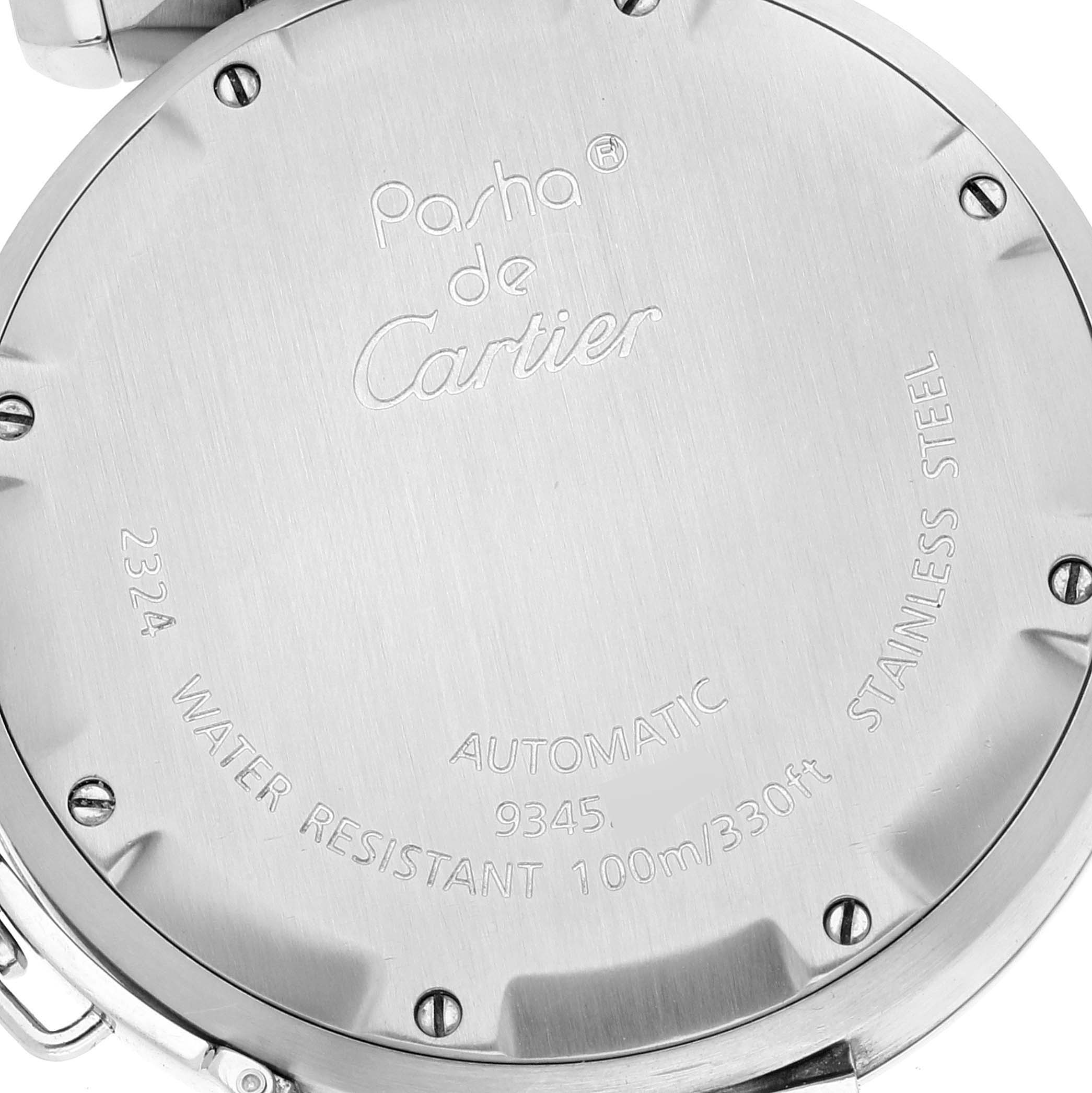 The image shows the back case of a Cartier Pasha W31074M7 Men
s Stainless Steel Silver Dial W31074M7 Men
s Stainless Steel Silver Dial model watch, highlighting its engravings, screws, and metal surface.