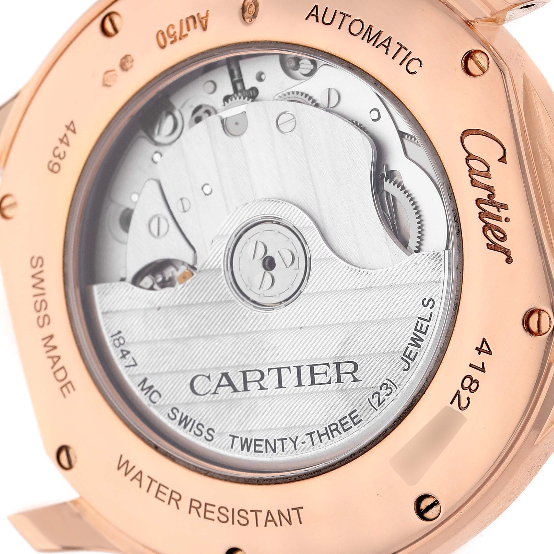 The image shows the Ronde model by Cartier from the back, revealing its automatic movement and engraved details.