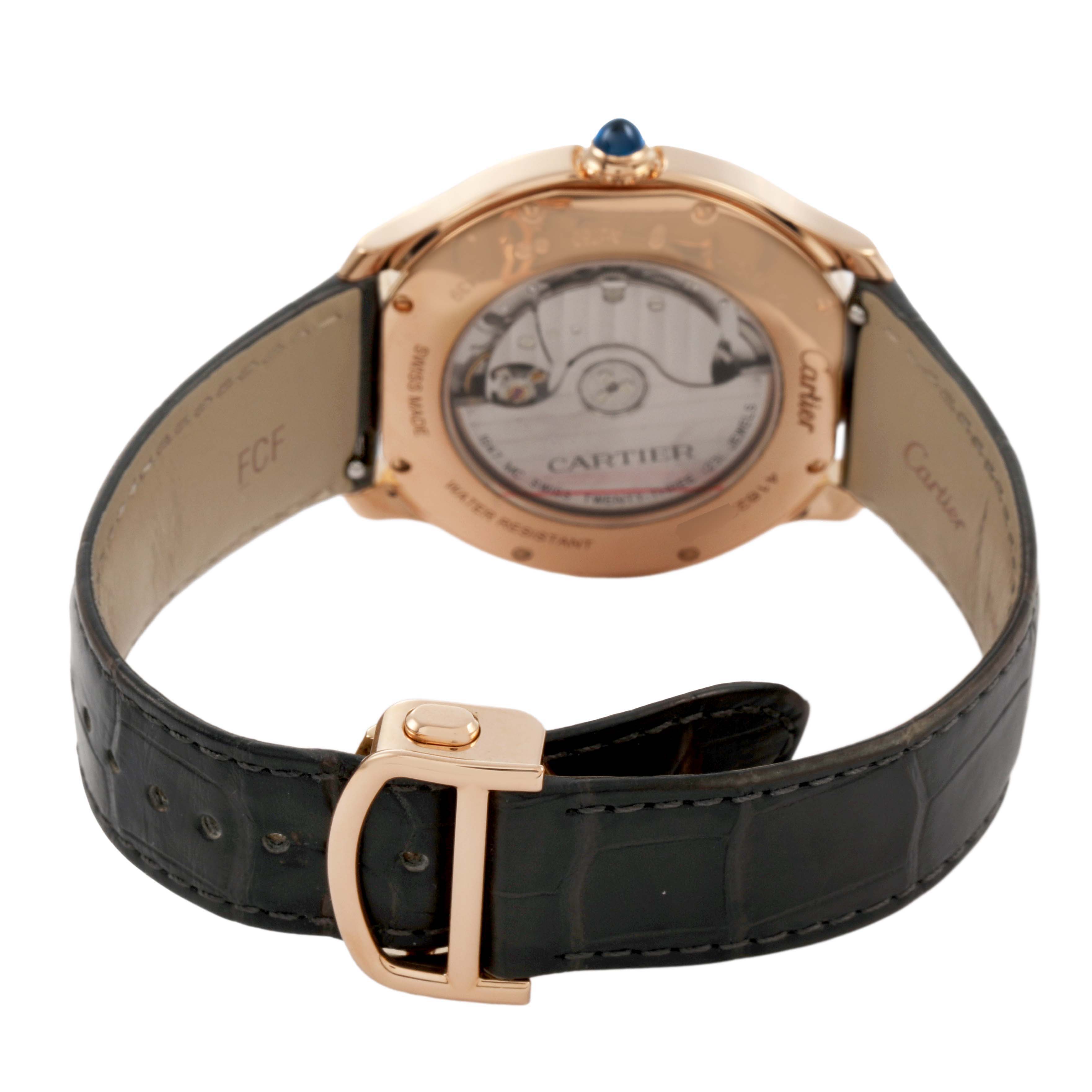 The image shows the back of the Cartier Ronde WGRN0011 Men's Rose Gold Silver Dial watch, highlighting the leather strap and buckle, with the transparent case back visible.