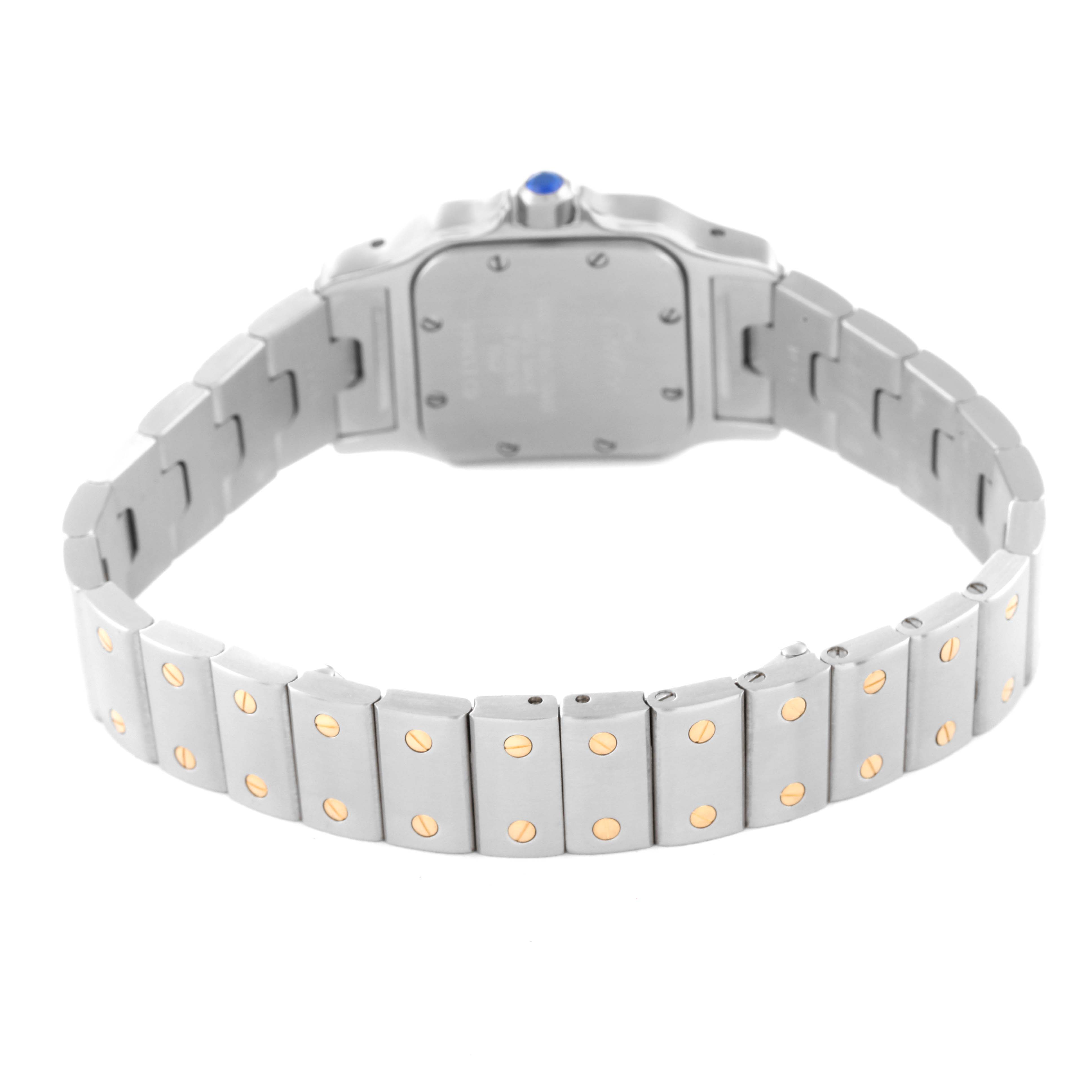 The image shows the back and bracelet of a Santos model watch by Cartier.