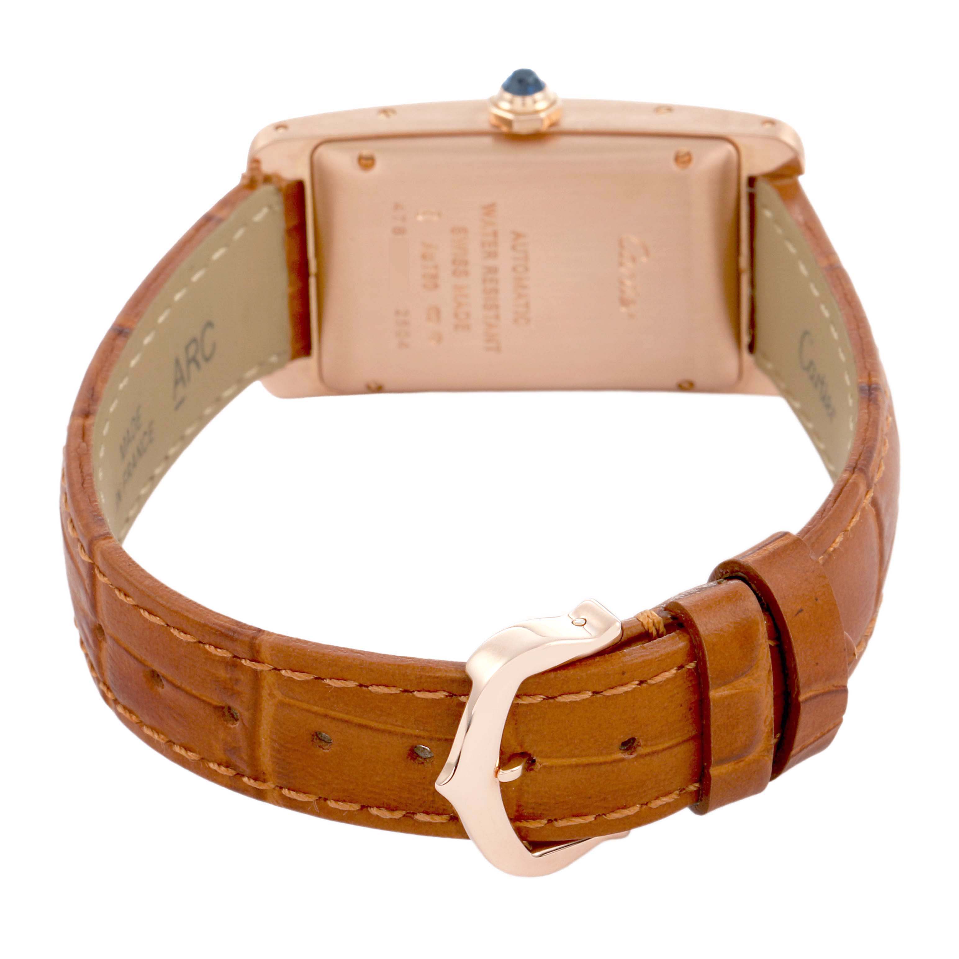 The image shows the back view of a Cartier Tank Americaine W2620030 Women's Rose Gold Silver Dial watch, highlighting the leather strap, buckle, and case back.