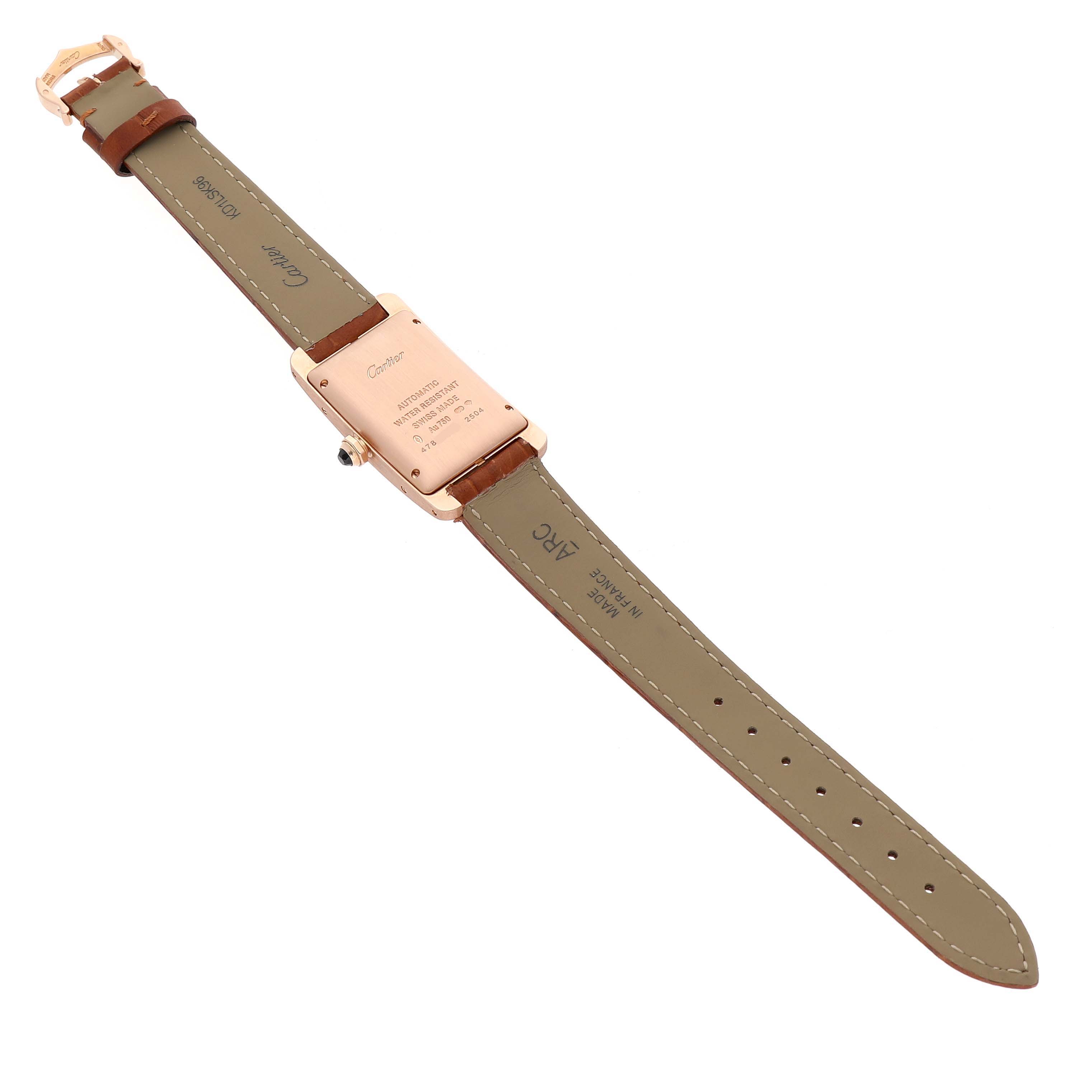 The image shows the back view of the Cartier Tank Américaine watch, displaying the strap, clasp, case back, and crown.