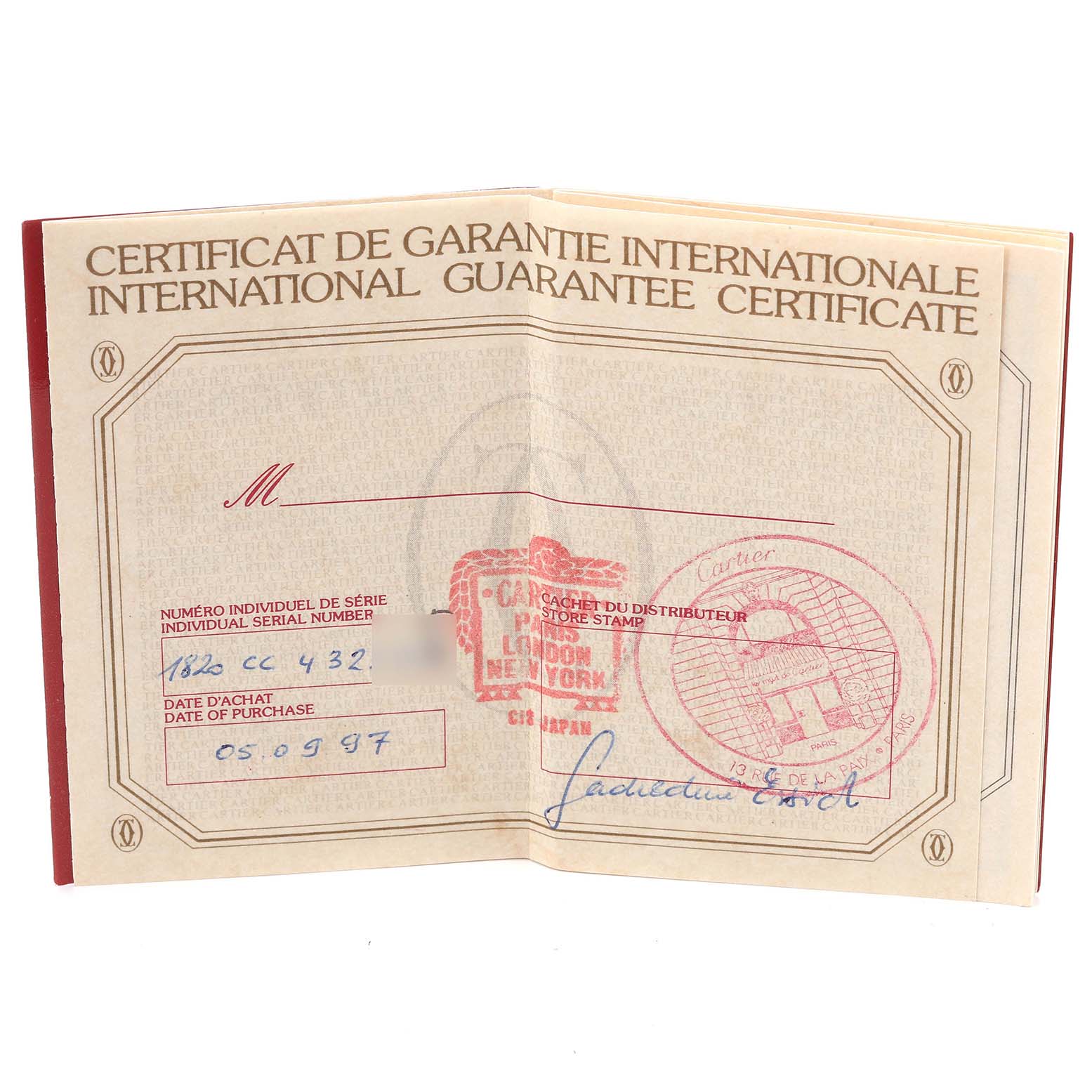 The image shows an international guarantee certificate for the Cartier Tank Francaise W5000256 Women
s Yellow Gold Silver Dial W5000256 Women
s Yellow Gold Silver Dial model, displayed fully open and flat.