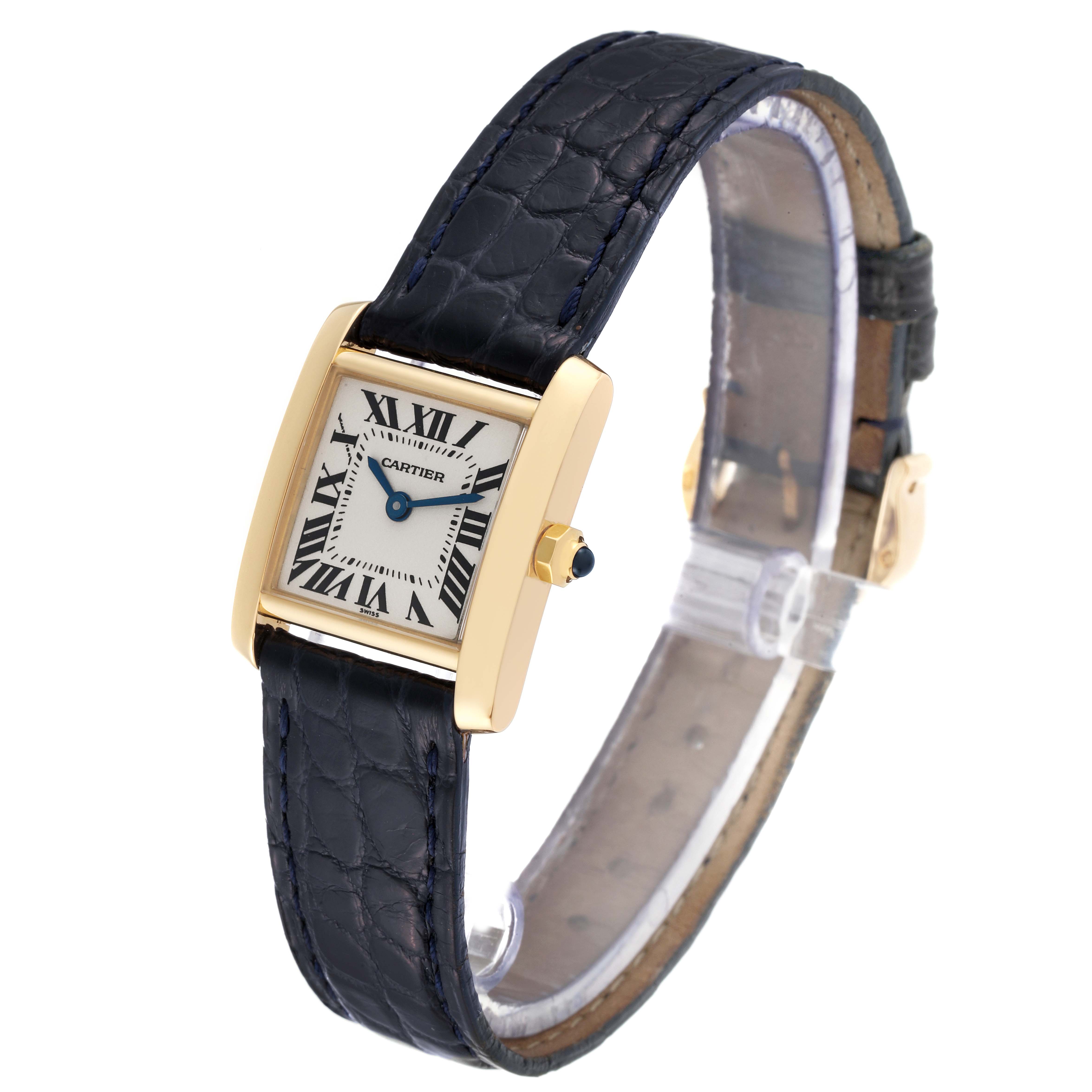 The image shows a Cartier Tank Francaise W5000256 Women
s Yellow Gold Silver Dial W5000256 Women
s Yellow Gold Silver Dial watch from an angled view highlighting its face, strap, and crown.