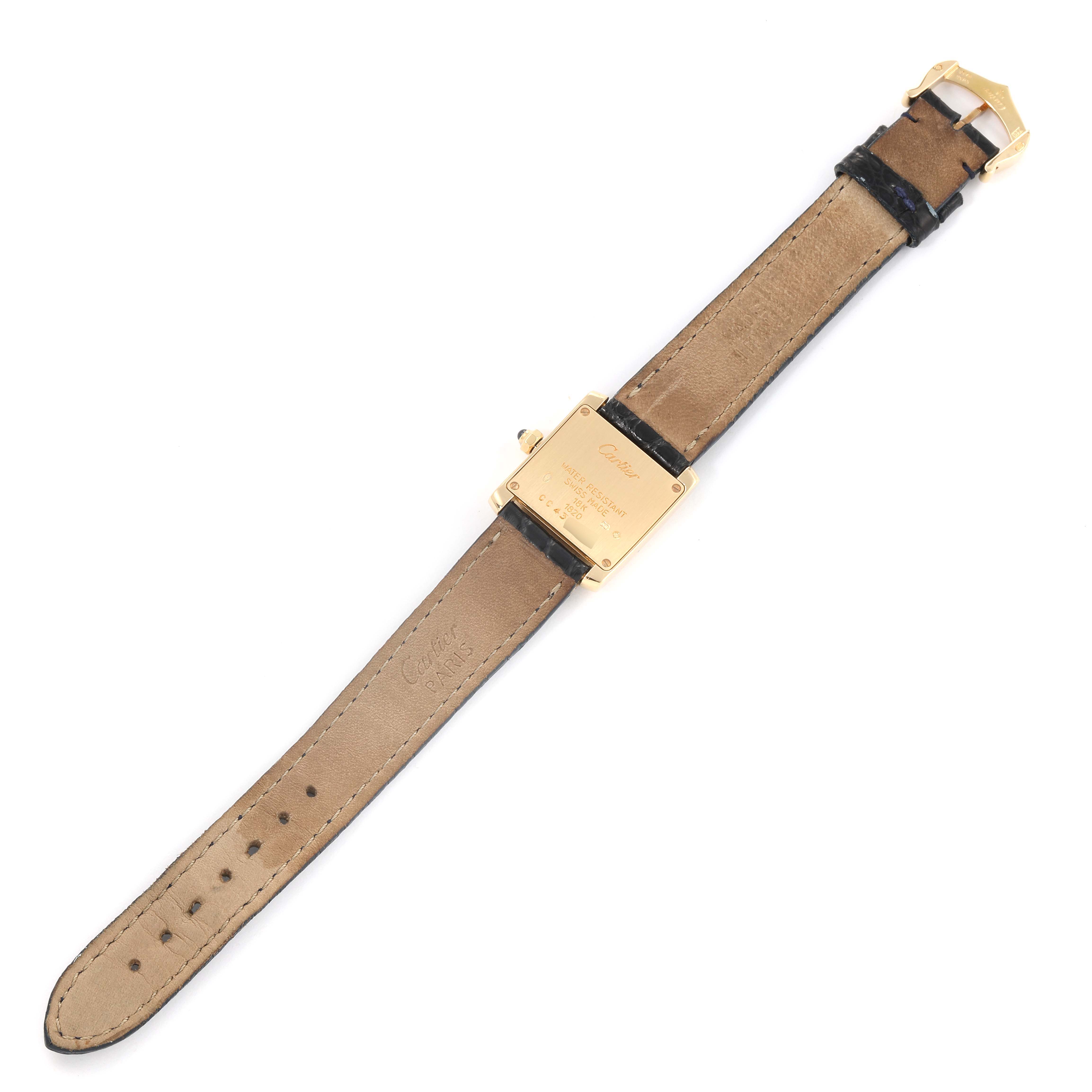 The image shows the back of the case and strap of a Cartier Tank Française watch laid flat.