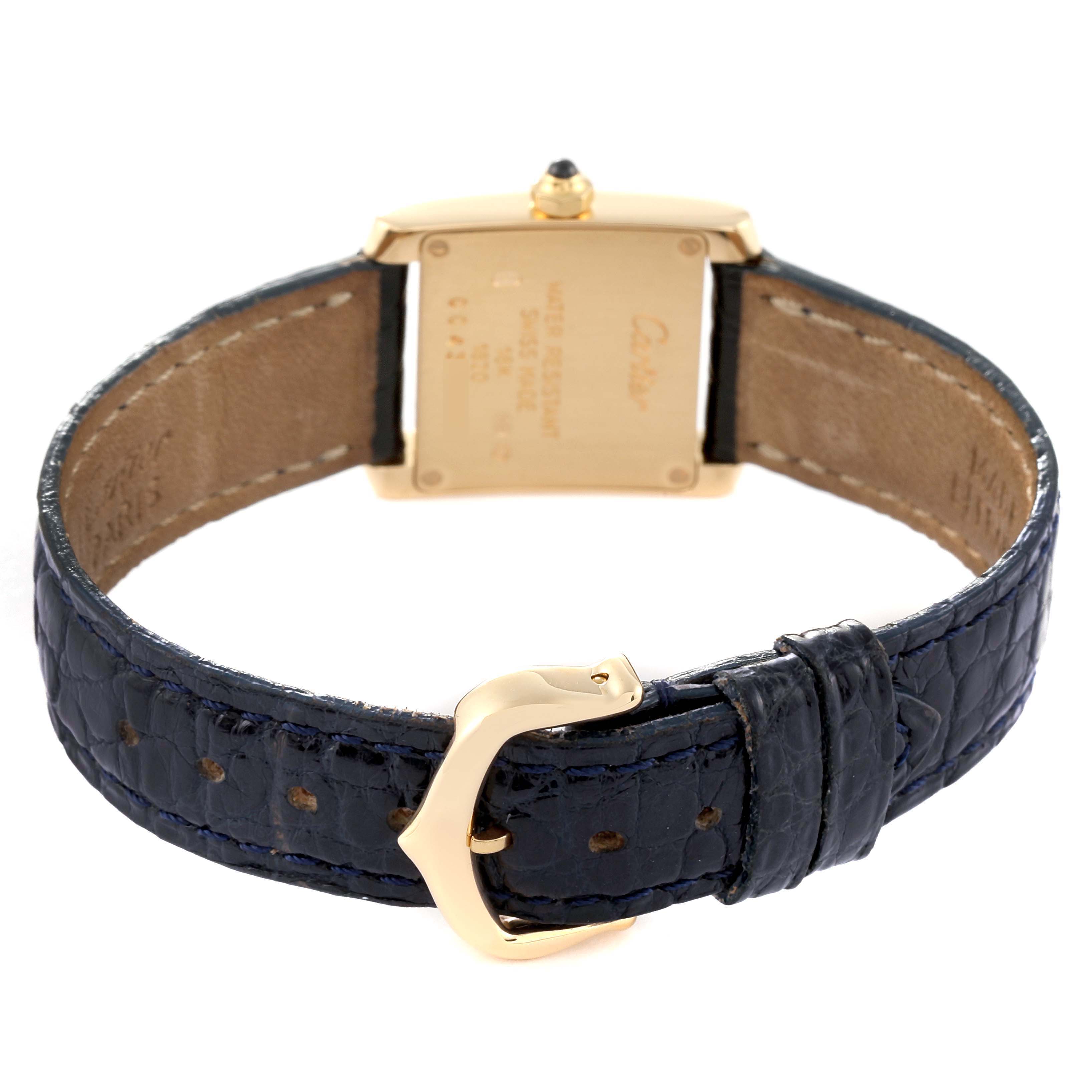 The image shows the back of the Cartier Tank Française watch, highlighting the leather strap and buckle.