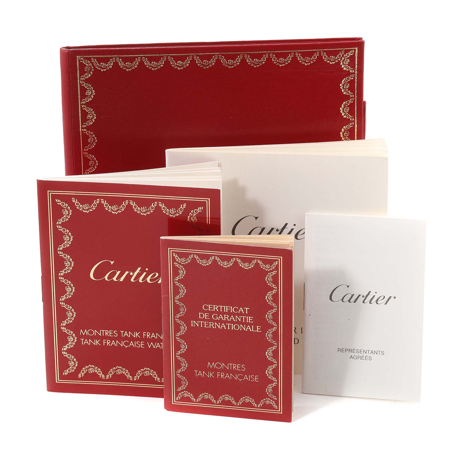 The image shows documentation and booklets for the Cartier Tank Francaise W5000256 Women
s Yellow Gold Silver Dial W5000256 Women
s Yellow Gold Silver Dial watch model, including a warranty certificate.