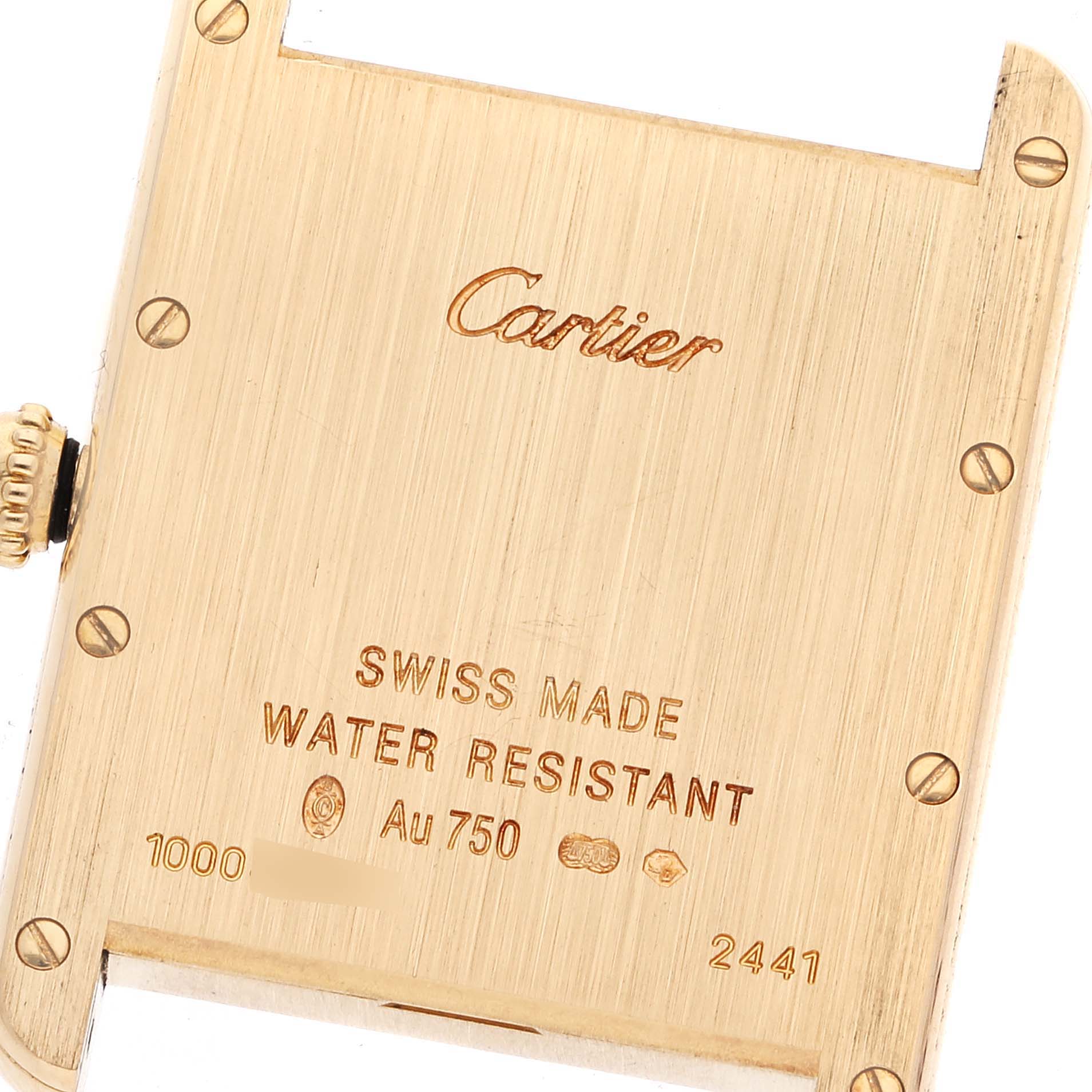 This image shows the back case of a Cartier Tank Louis W1529756 Men's Yellow Gold Silver Dial W1529756 Men's Yellow Gold Silver Dial watch, featuring engravings and screws.