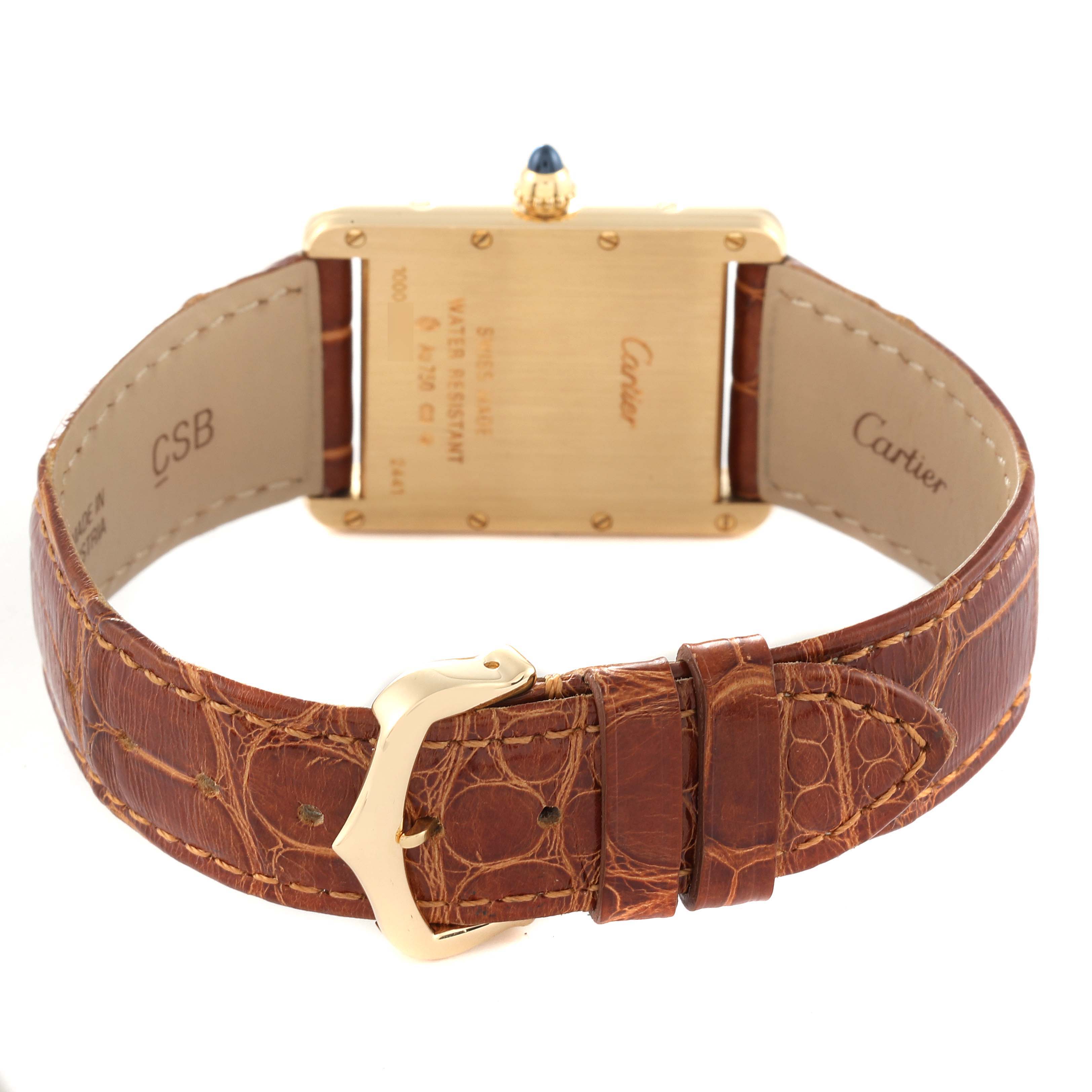 This image shows the back of the Cartier Tank Louis W1529756 Men's Yellow Gold Silver Dial W1529756 Men's Yellow Gold Silver Dial watch, including the case, buckle, and leather strap.