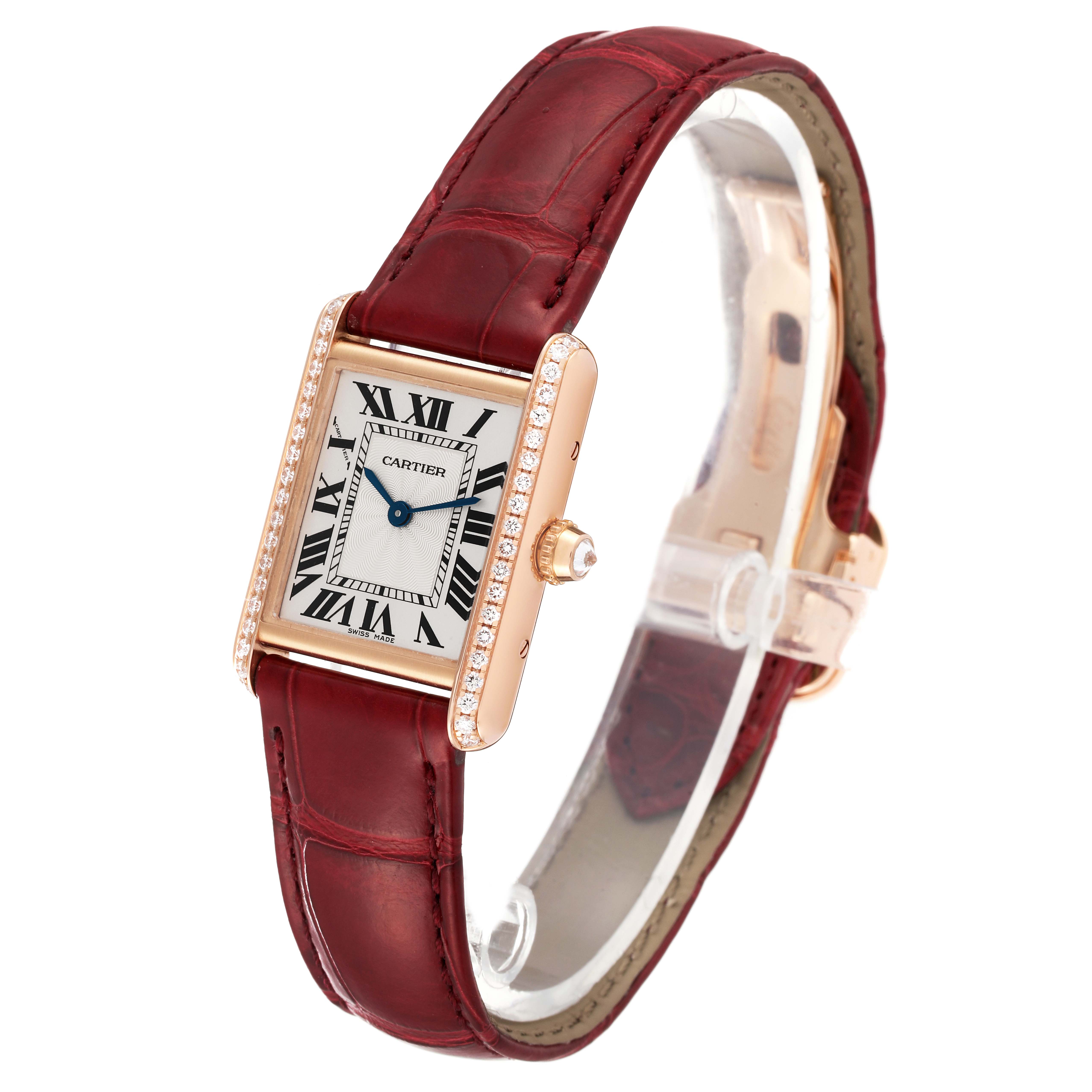 The Cartier Tank Louis WJTA0037 Women's Rose Gold Silver Dial WJTA0037 Women's Rose Gold Silver Dial watch is shown at an angle highlighting the face, crown, and strap with a red leather band.