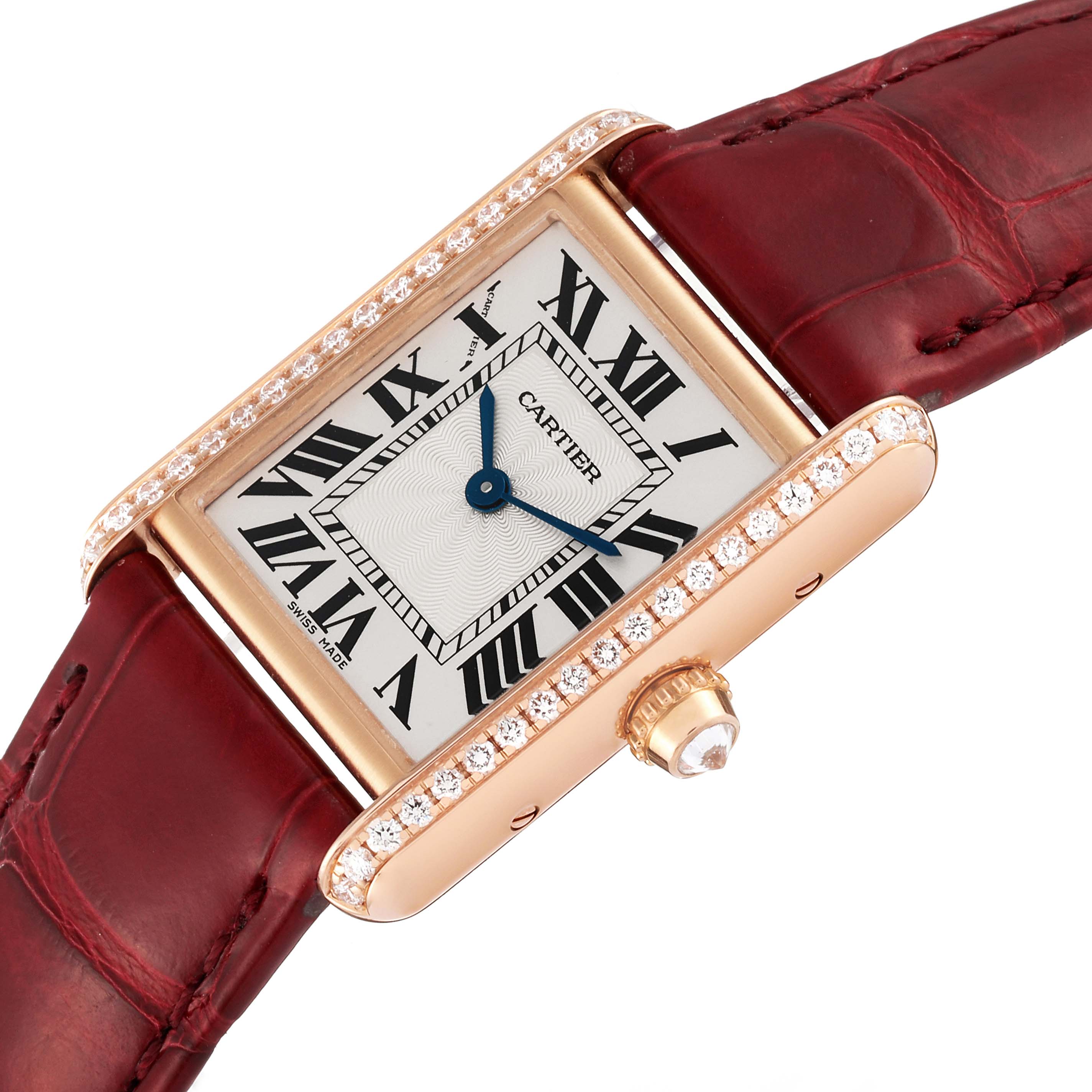 The image shows a Cartier Tank Louis WJTA0037 Women's Rose Gold Silver Dial WJTA0037 Women's Rose Gold Silver Dial watch at an angle displaying its rectangular face, Roman numerals, blue hands, and diamond-encrusted bezel with a red leather strap.
