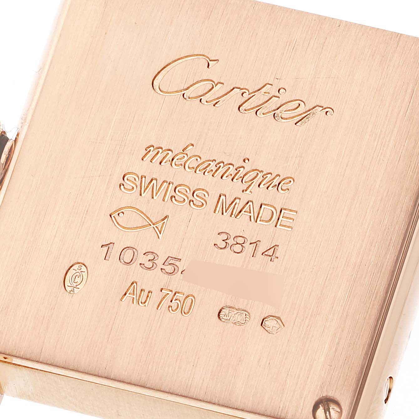 This image shows the back case of a Cartier Tank Louis WJTA0037 Women's Rose Gold Silver Dial WJTA0037 Women's Rose Gold Silver Dial watch, highlighting its engravings and hallmarks.