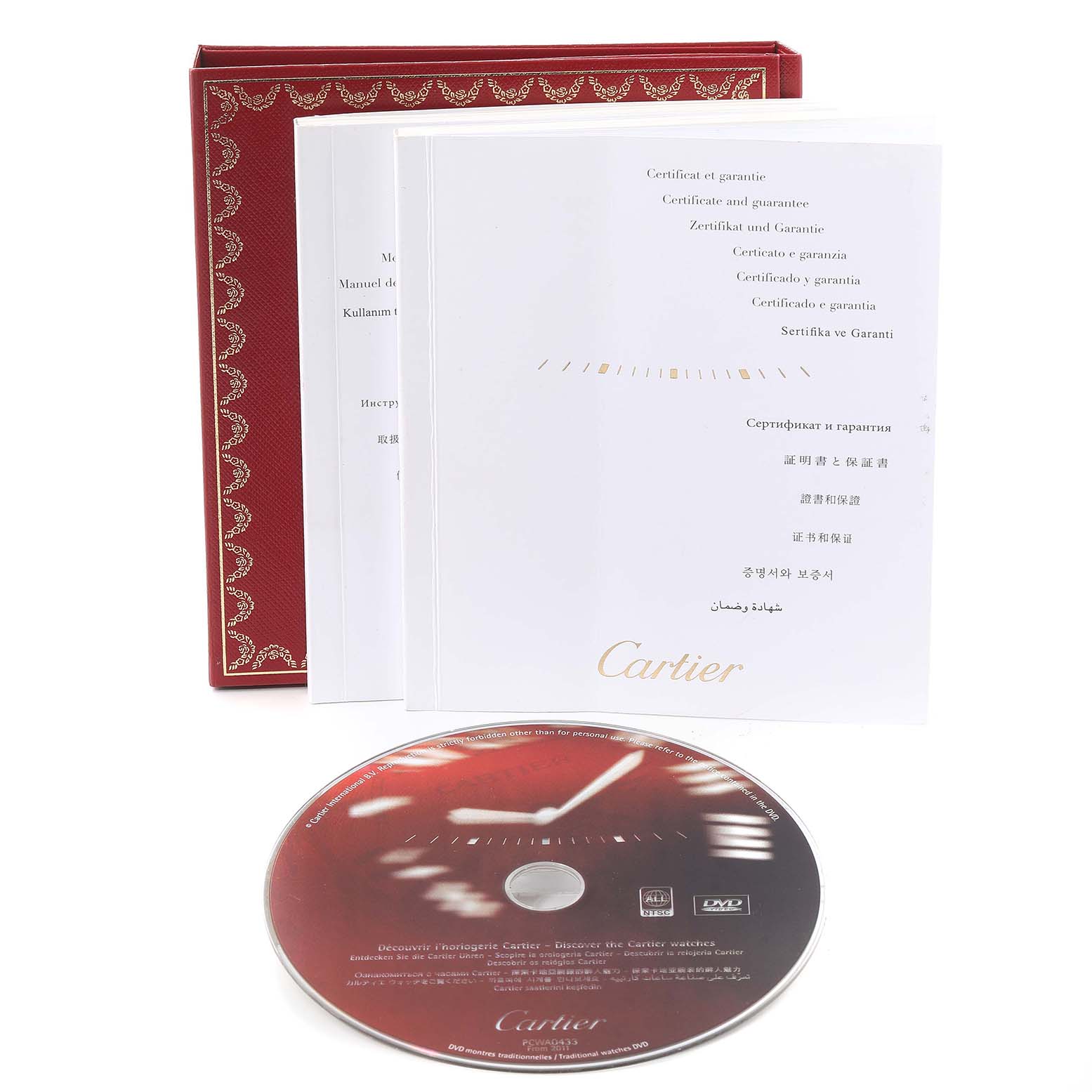 The image shows the manuals, warranty certificate, and a CD for the Cartier Tank Louis W1529856 Women's Yellow Gold Silver Dial W1529856 Women's Yellow Gold Silver Dial watch, along with the red Cartier box.