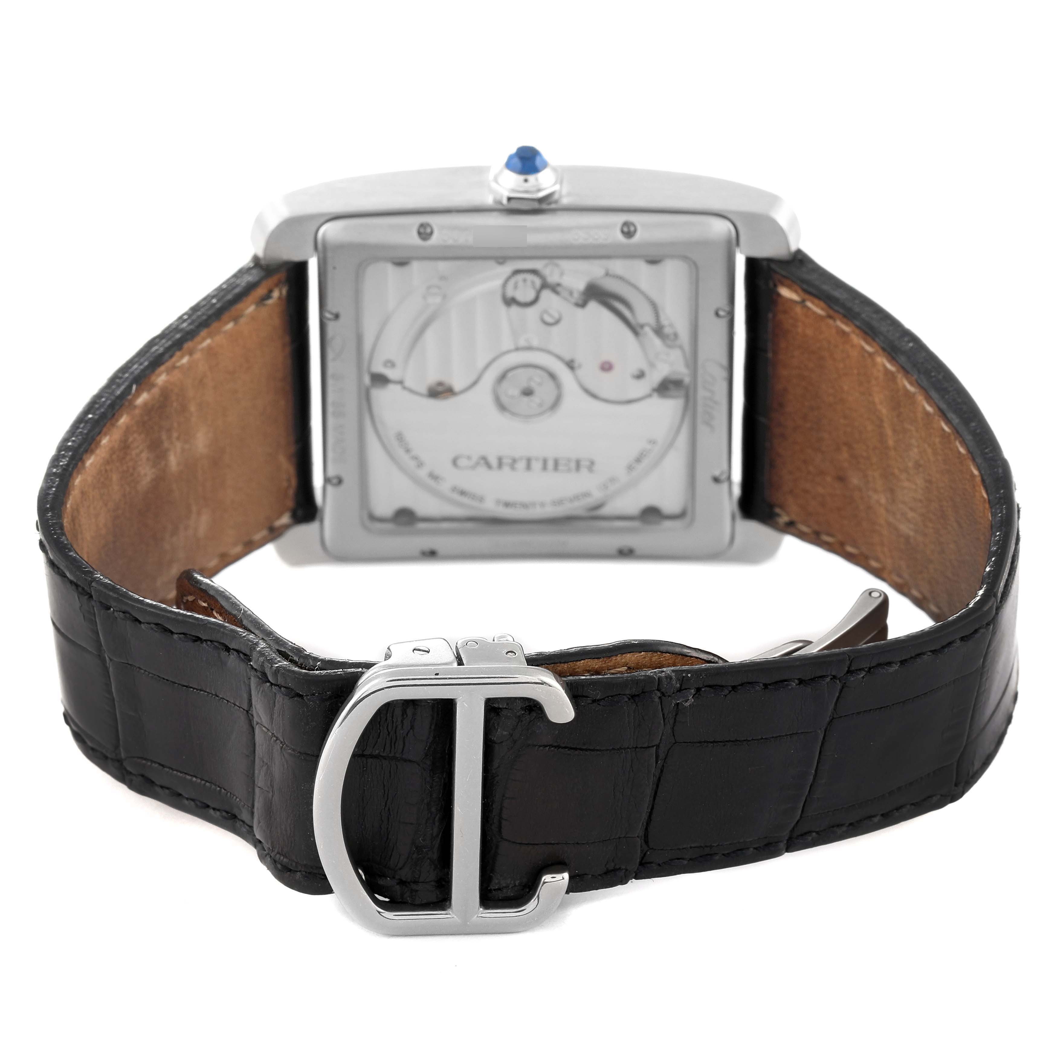 The Cartier Tank MC W5330003 Men
s Stainless Steel Silver Dial W5330003 Men
s Stainless Steel Silver Dial watch is shown from the back, displaying its movement and black leather strap.