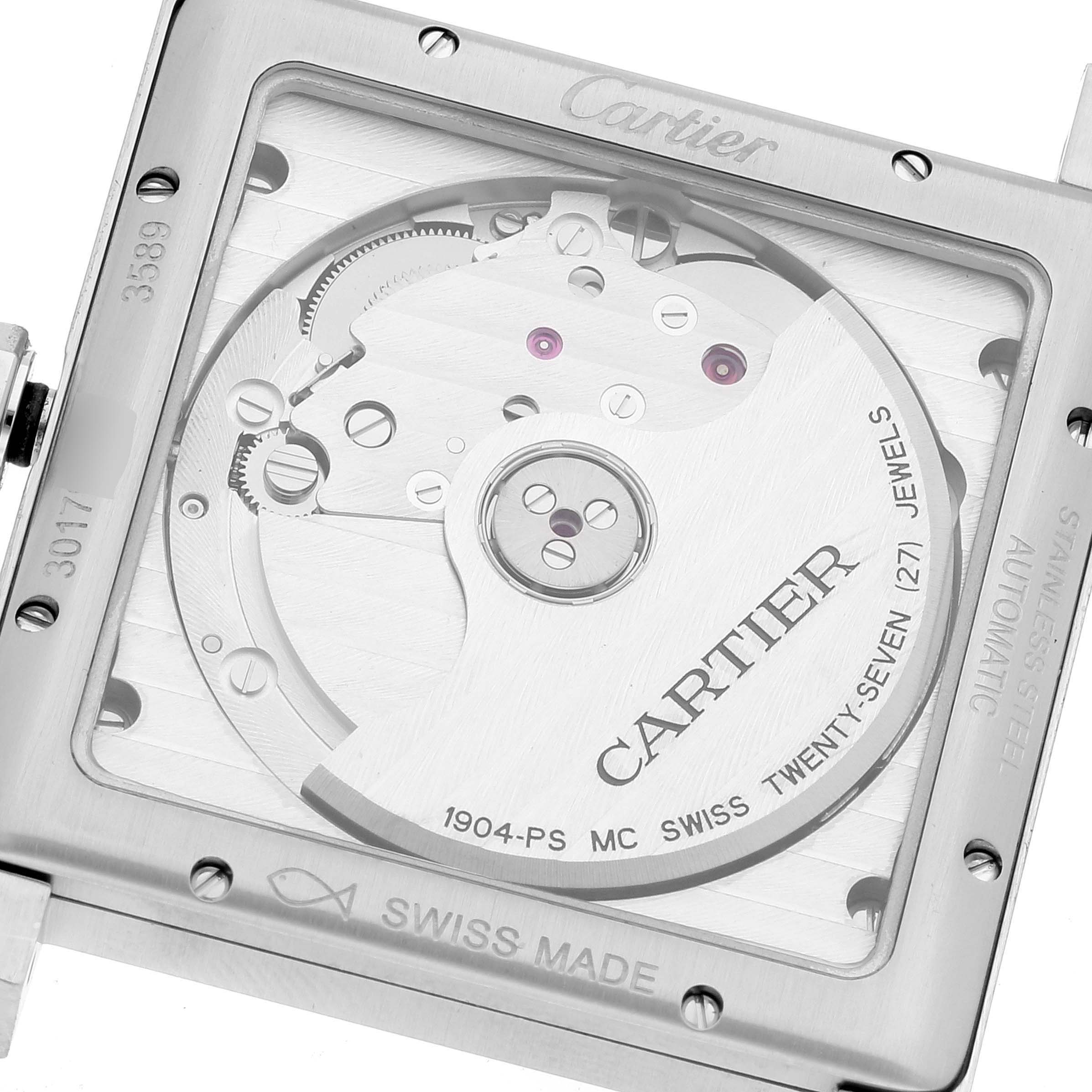 This image shows the back view of the Cartier Tank MC W5330003 Men
s Stainless Steel Silver Dial W5330003 Men
s Stainless Steel Silver Dial watch, highlighting its mechanism and the inscriptions on the movement.