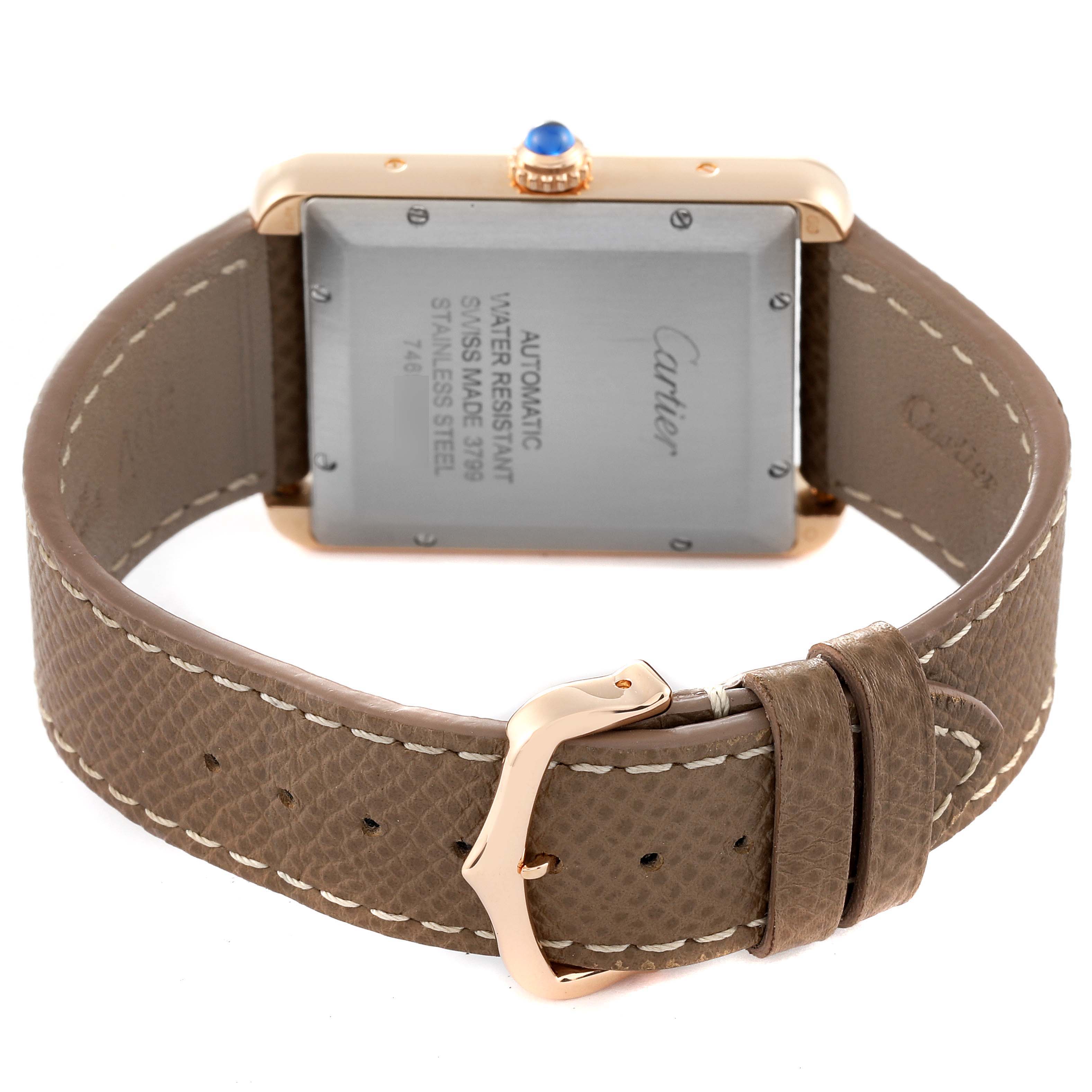 The image shows the back view of the Cartier Tank Solo W5200026 Men's Rose Gold Silver Dial W5200026 Men's Rose Gold Silver Dial watch, featuring its leather strap, buckle, and case back details.