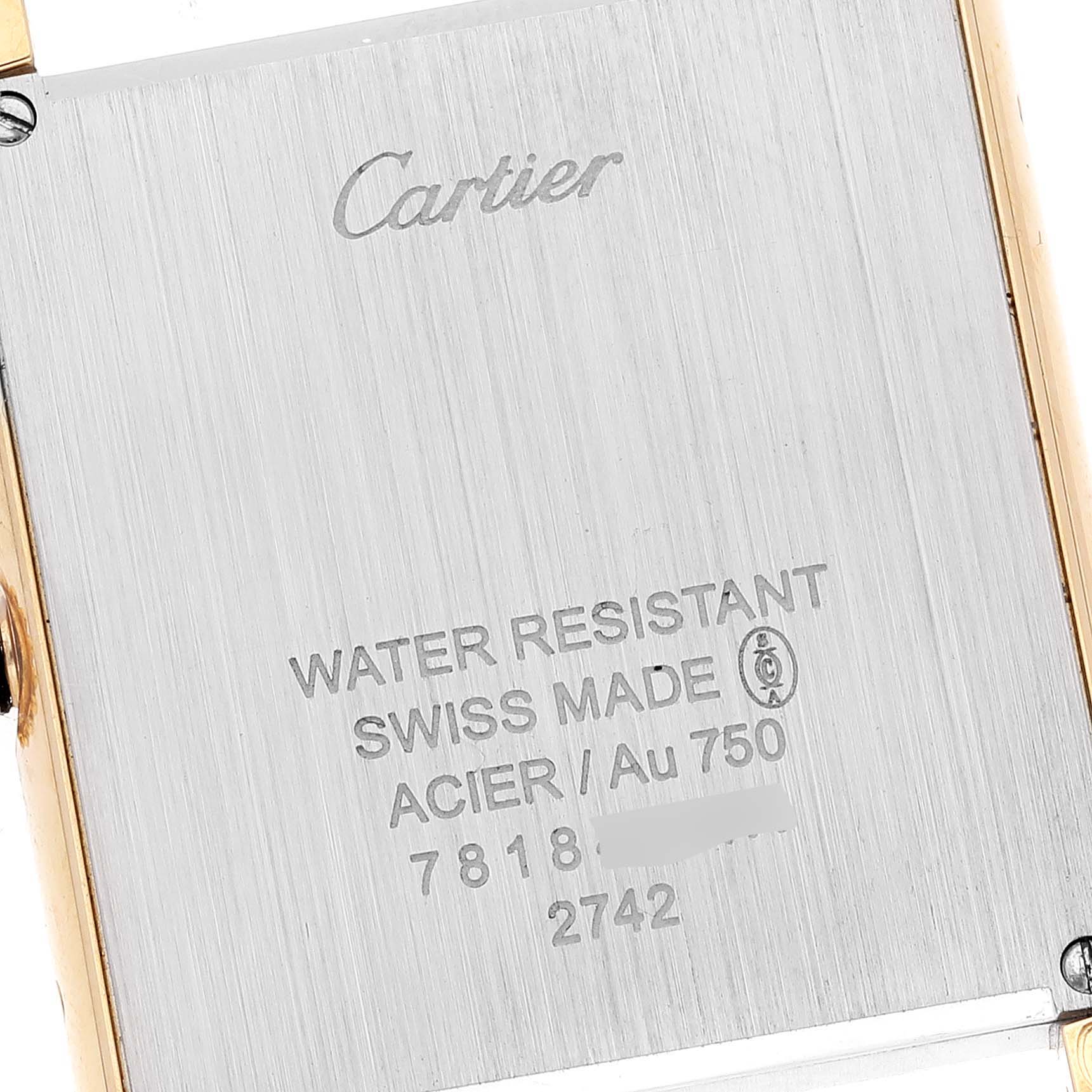 This image shows the back case of the Cartier Tank Solo W1018855 Men's Yellow Gold Silver Dial W1018855 Men's Yellow Gold Silver Dial watch at a close-up angle, highlighting engraved details.