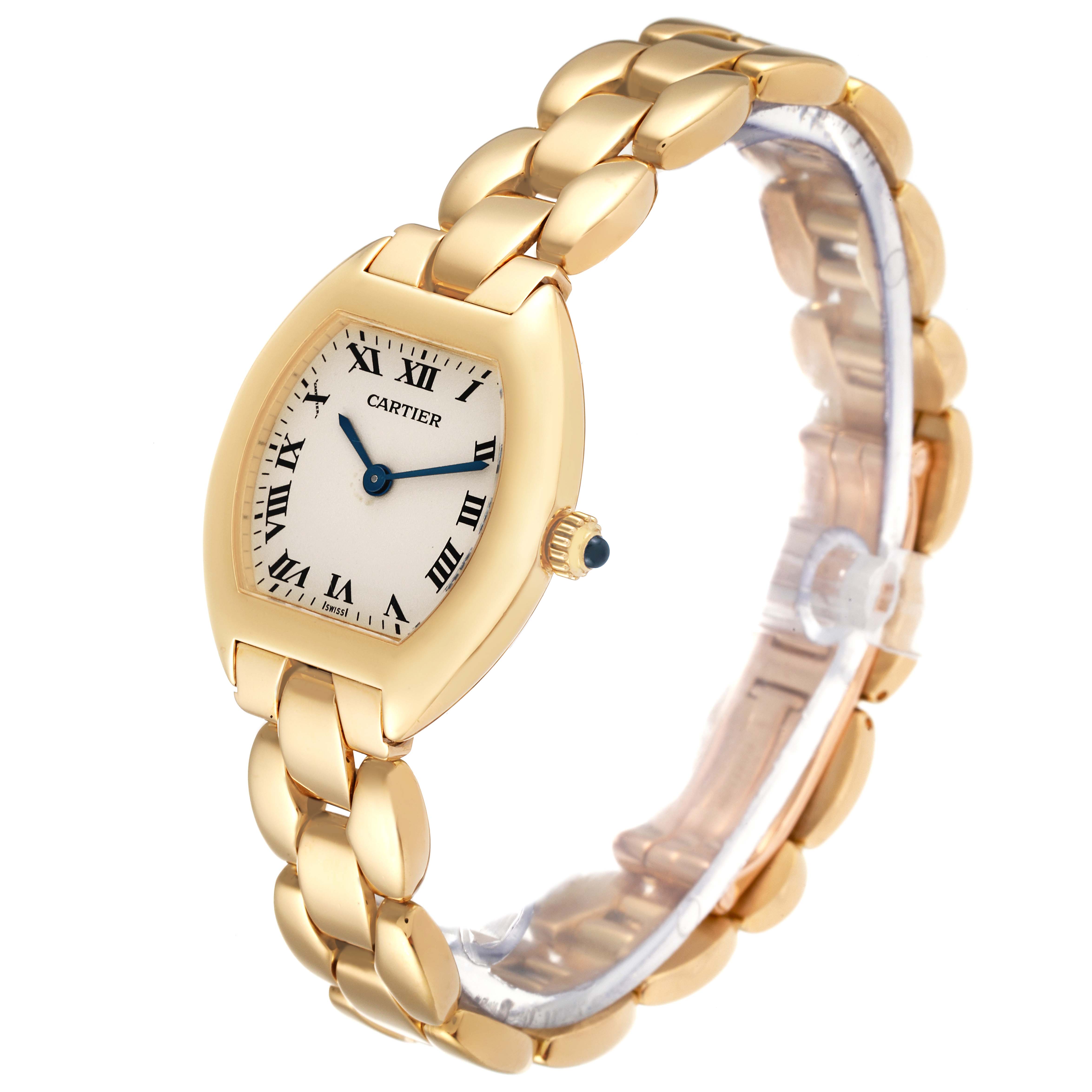 This image shows a Cartier Tortue 1945 Women's Yellow Gold Silver Dial 1945 Women's Yellow Gold Silver Dial watch, angled to display the face, bracelet, and crown with blue cabochon.