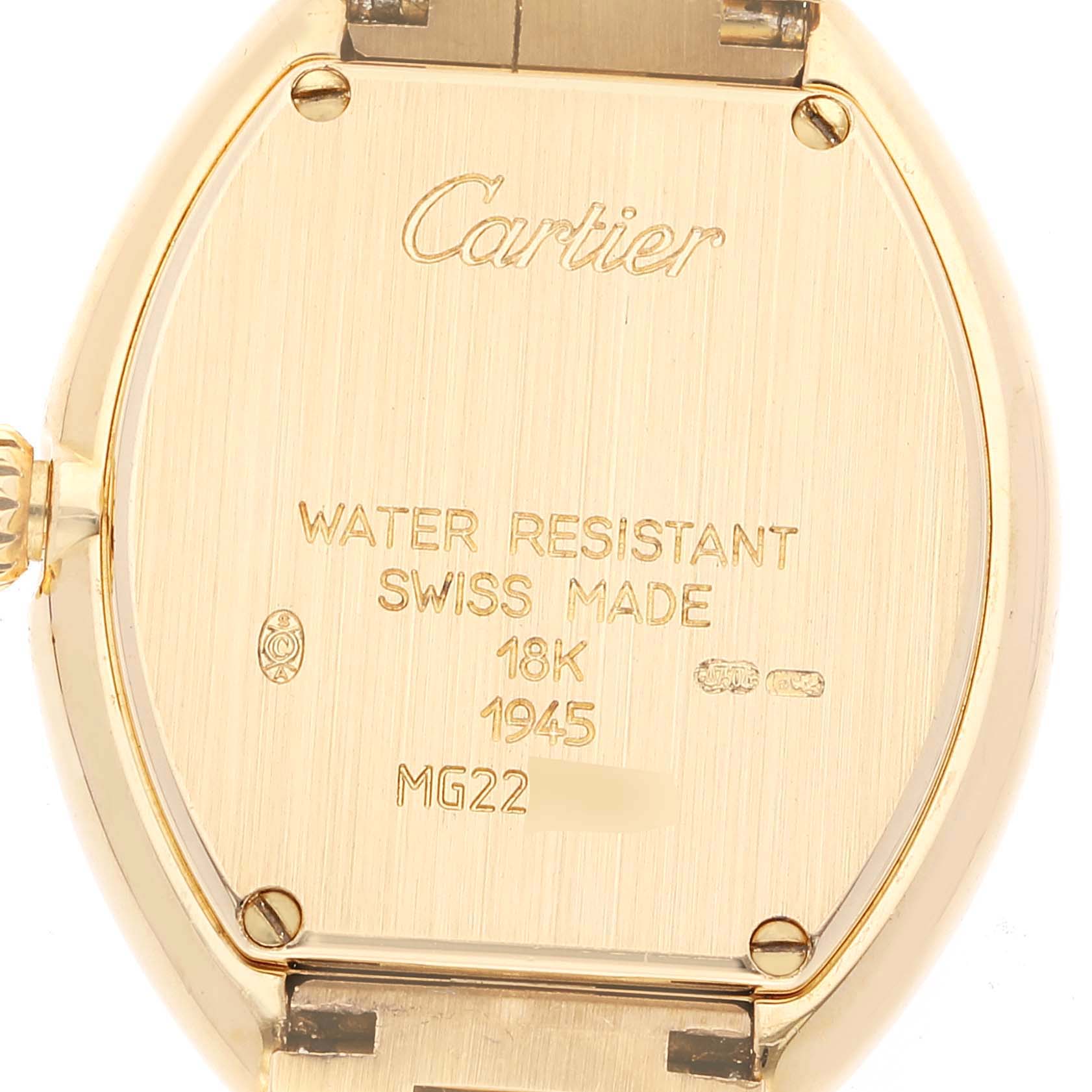 The image shows the back of a Cartier Tortue 1945 Women's Yellow Gold Silver Dial 1945 Women's Yellow Gold Silver Dial watch, highlighting its gold case and engraved details.