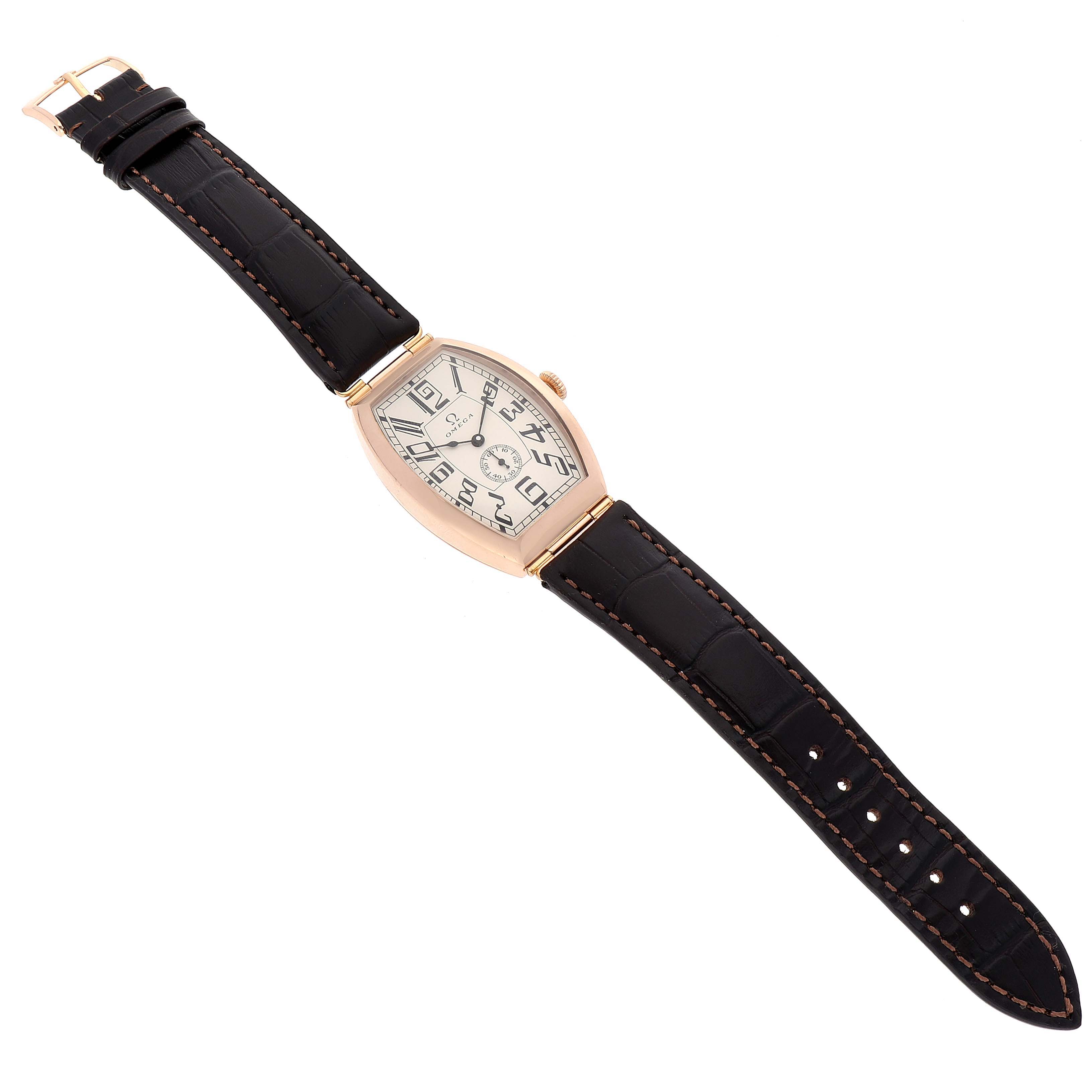 The Museum model by Omega is shown from a top-down angle, displaying the dial, full strap, and buckle.