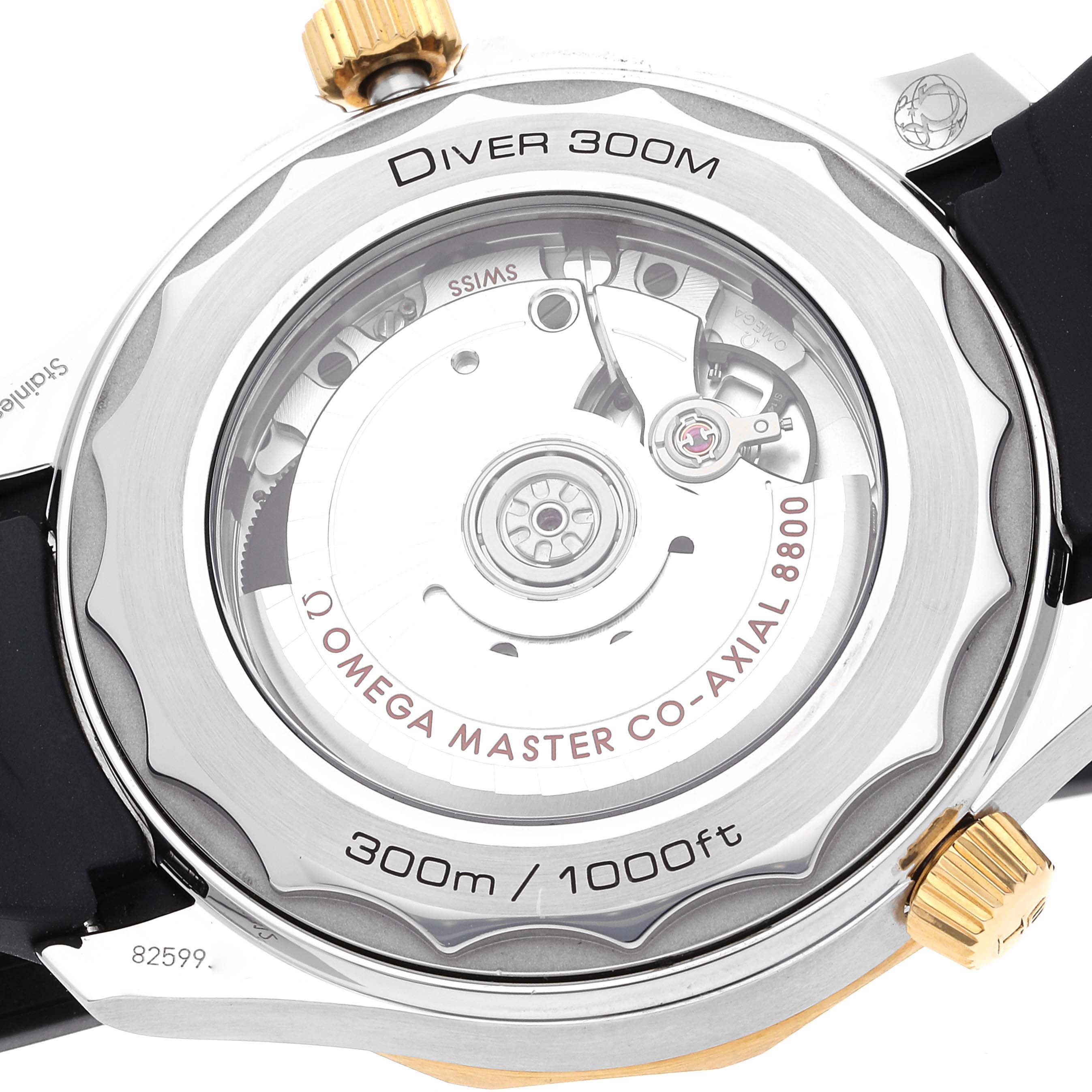 The image shows the back case of the Omega Seamaster 210.22.42.20.01.001 Men's Steel and Gold (two tone) Black Dial 210.22.42.20.01.001 Men's Steel and Gold (two tone) Black Dial Diver 300M, revealing the automatic movement inside.