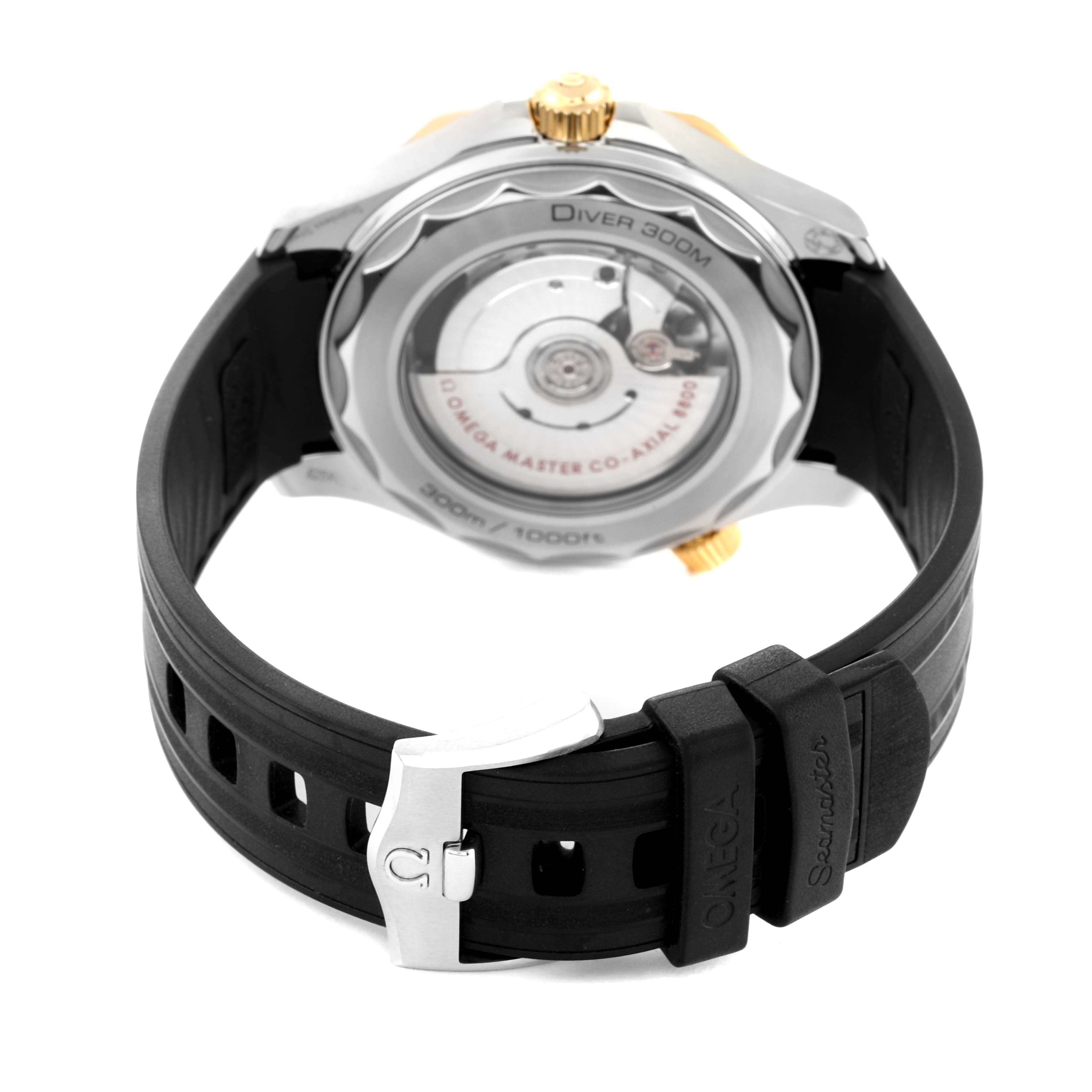 The image shows the back view of an Omega Seamaster 210.22.42.20.01.001 Men's Steel and Gold (two tone) Black Dial 210.22.42.20.01.001 Men's Steel and Gold (two tone) Black Dial watch with a visible movement and a black rubber strap.