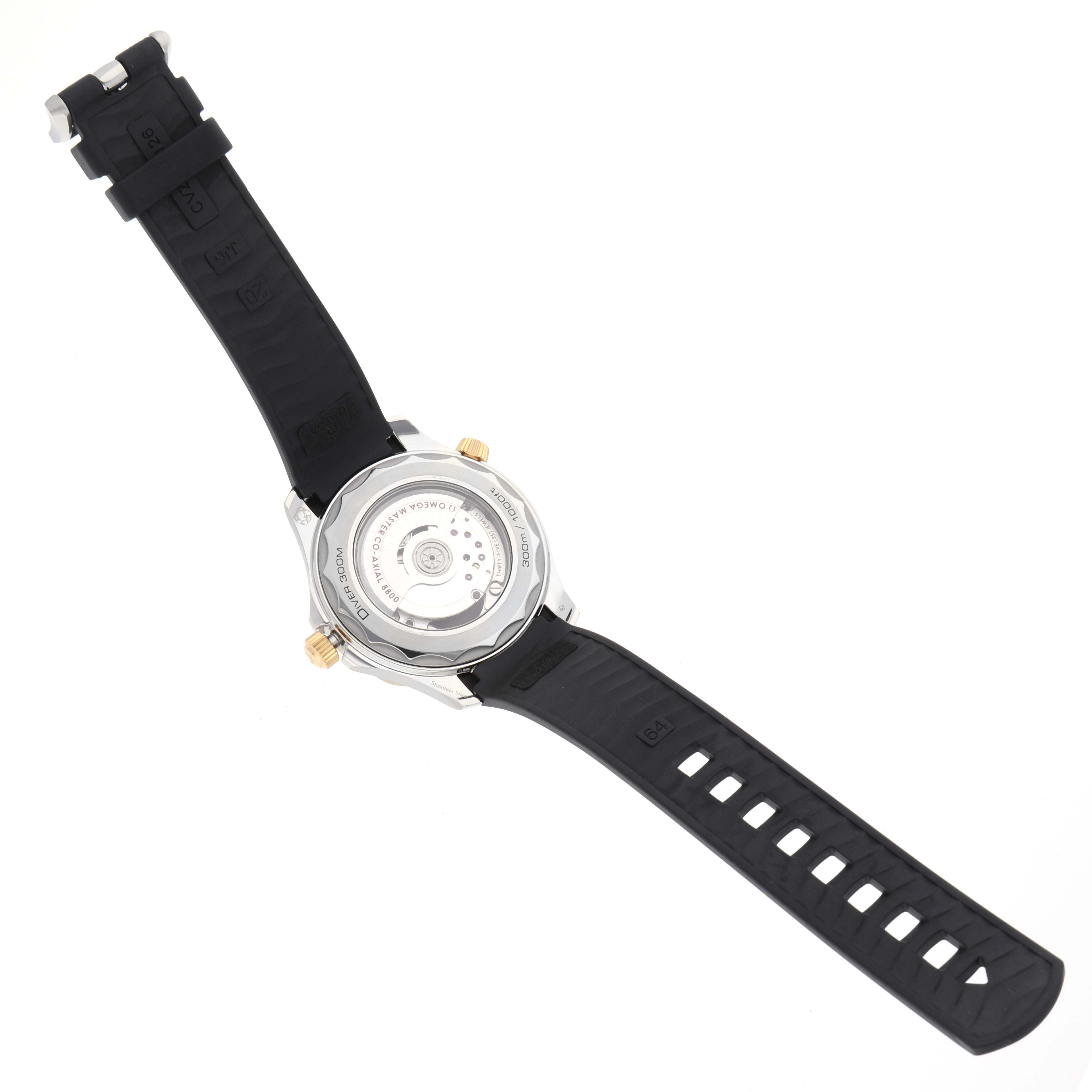 The image shows the back view of an Omega Seamaster 210.22.42.20.01.001 Men's Steel and Gold (two tone) Black Dial 210.22.42.20.01.001 Men's Steel and Gold (two tone) Black Dial watch, highlighting its automatic movement and black rubber strap.