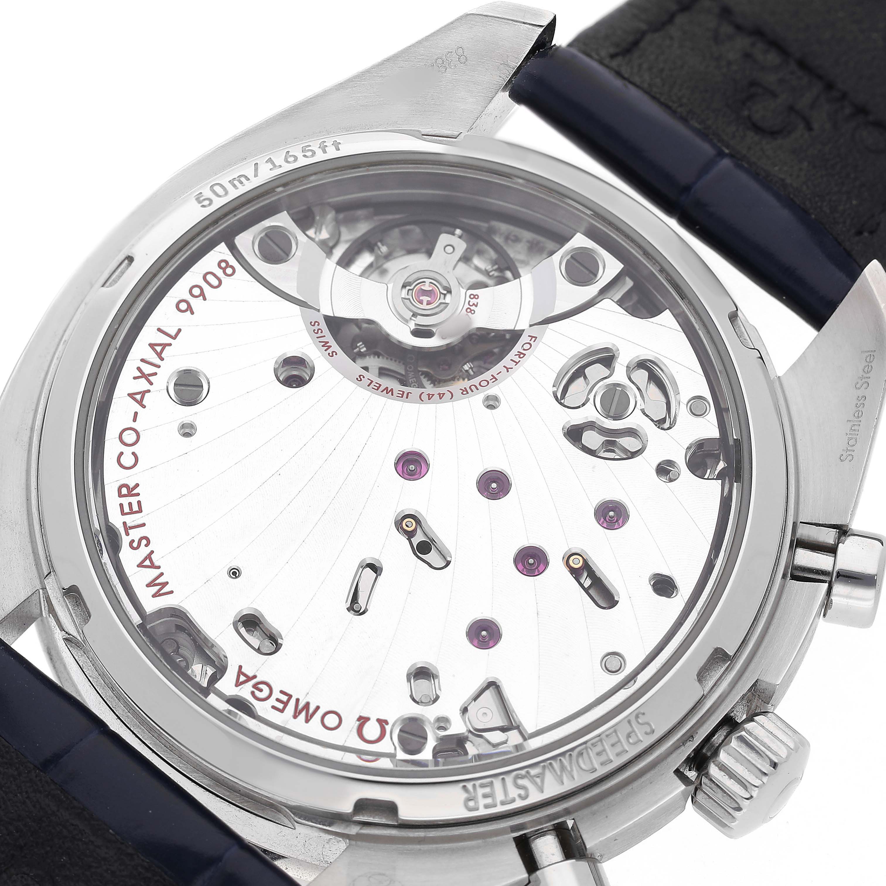 The image shows the back case of an Omega Speedmaster 329.33.43.51.02.001 Men's Stainless Steel Silver Dial, highlighting its Co-Axial 9908 movement.