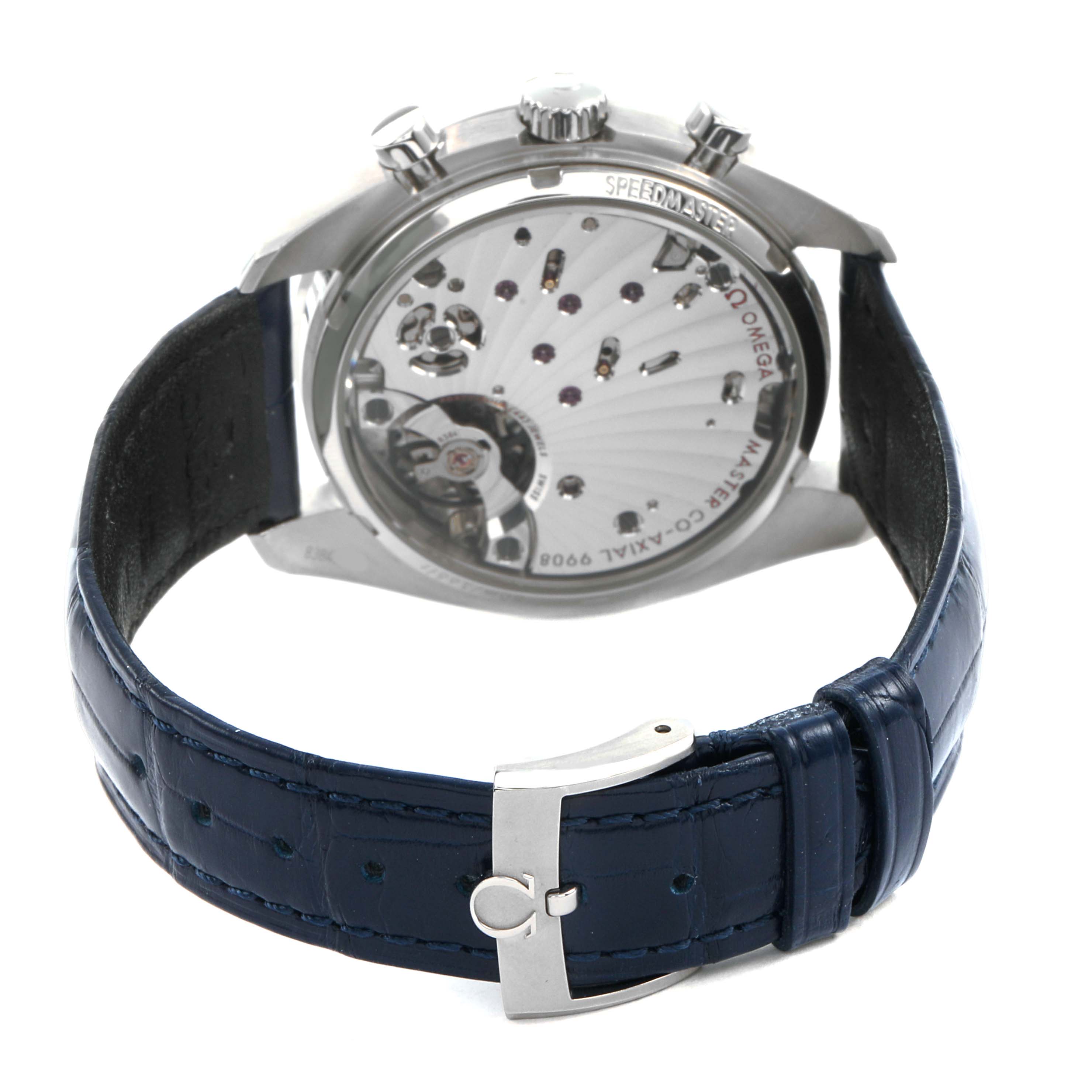 The Omega Speedmaster 329.33.43.51.02.001 Men's Stainless Steel Silver Dial watch is shown from the back, highlighting the movement and blue strap with clasp.