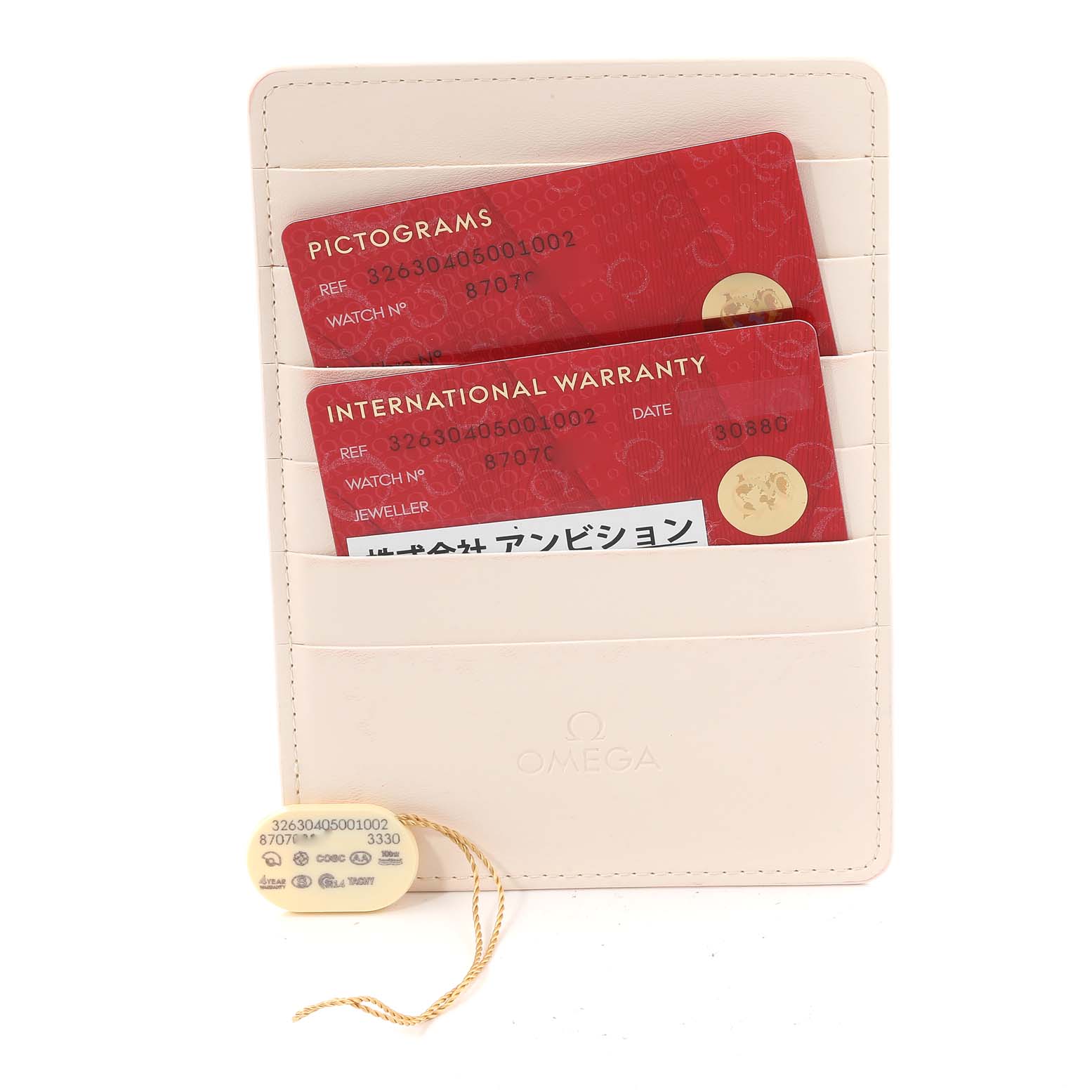 This image shows the warranty cards and accessory tag for an Omega Speedmaster 326.30.40.50.01.002 Men
s Stainless Steel Black Dial 326.30.40.50.01.002 Men
s Stainless Steel Black Dial watch.