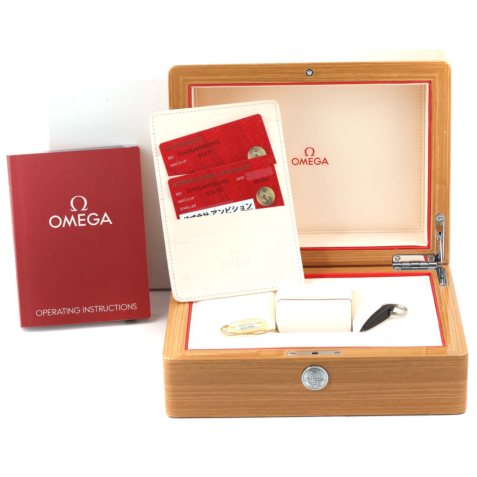 The image shows the packaging, operating instructions, warranty cards, and a wooden box for the Omega Speedmaster 326.30.40.50.01.002 Men
s Stainless Steel Black Dial 326.30.40.50.01.002 Men
s Stainless Steel Black Dial watch.