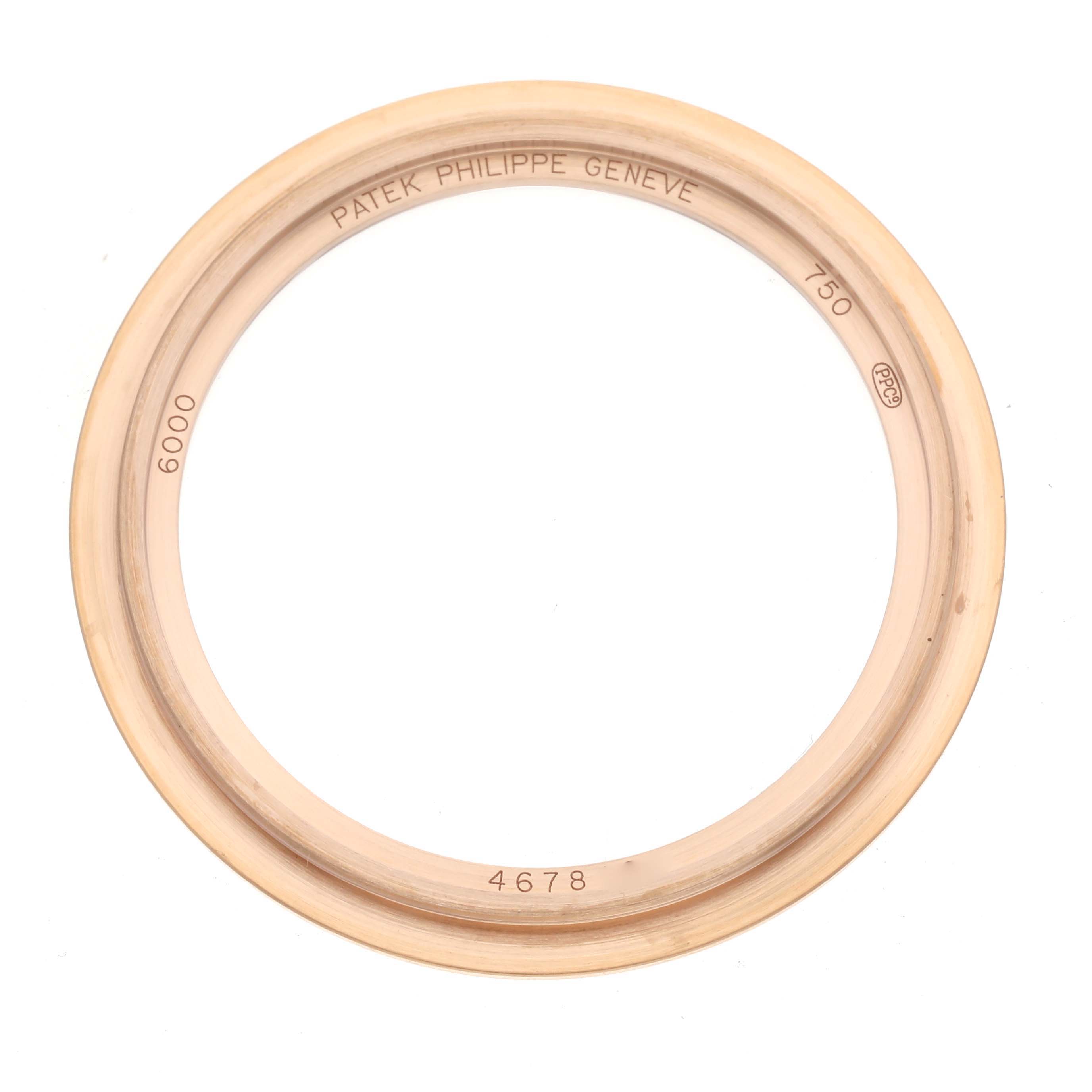 This image shows a close-up of the bezel for a Patek Philippe Calatrava 6000R-001 Men's Rose Gold Brown Dial 6000R-001 Men's Rose Gold Brown Dial watch, viewed from above.