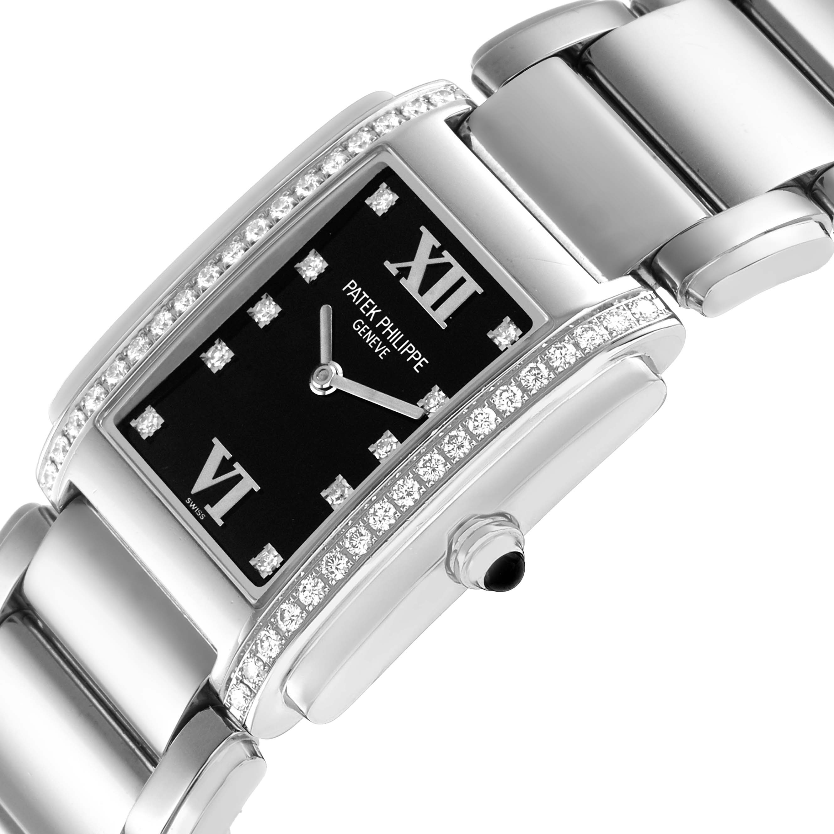 The image shows the Patek Philippe Twenty-4 4910/10A Women's Stainless Steel Black Dial model at an angled view, highlighting the watch face, crown, and bracelet with diamond detailing.
